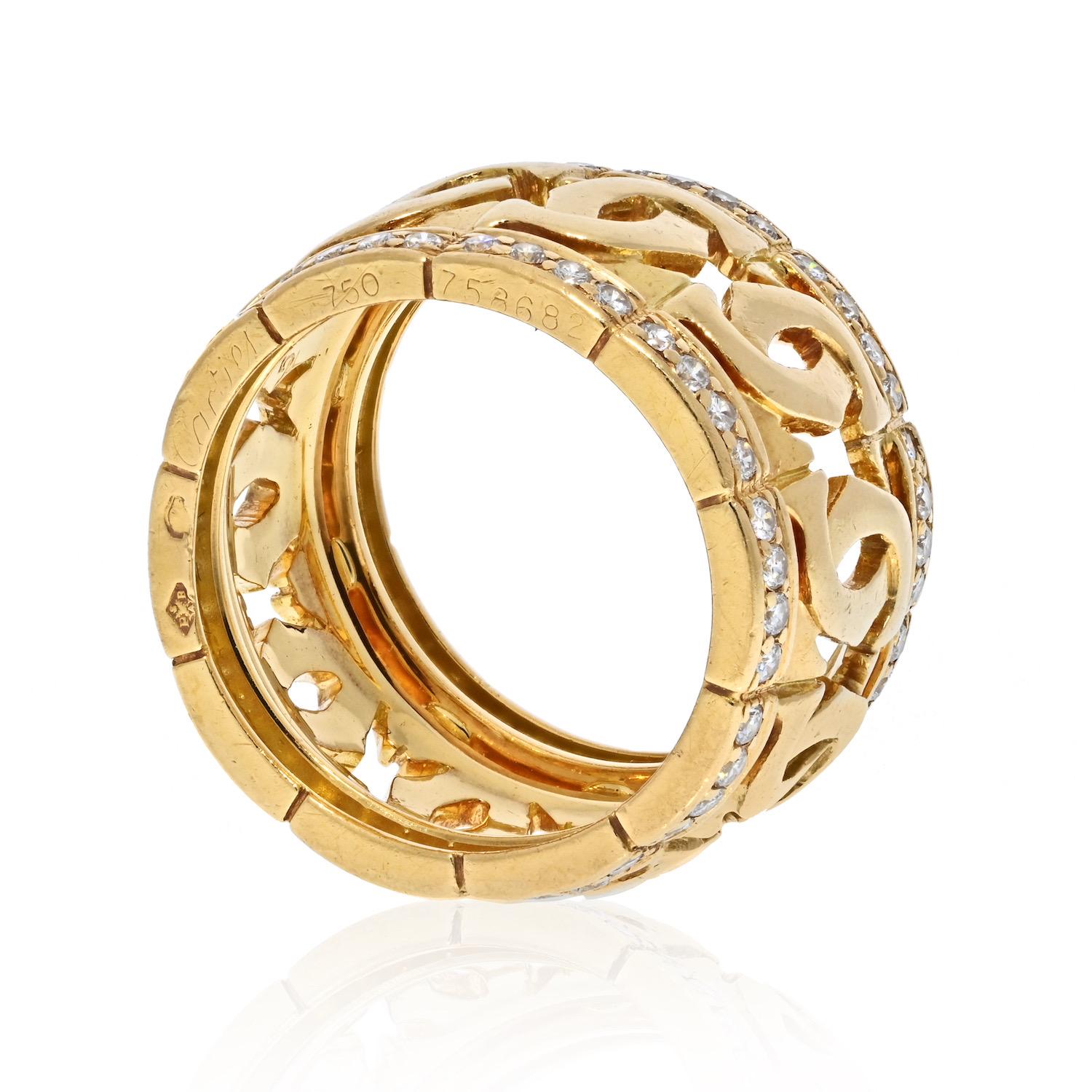 Beautiful ring by Cartier crafted in 18K gold; set with round brilliant-cut diamonds; width measures 1/2 inch; ring size 6-1/2; weight 11.55 g.
