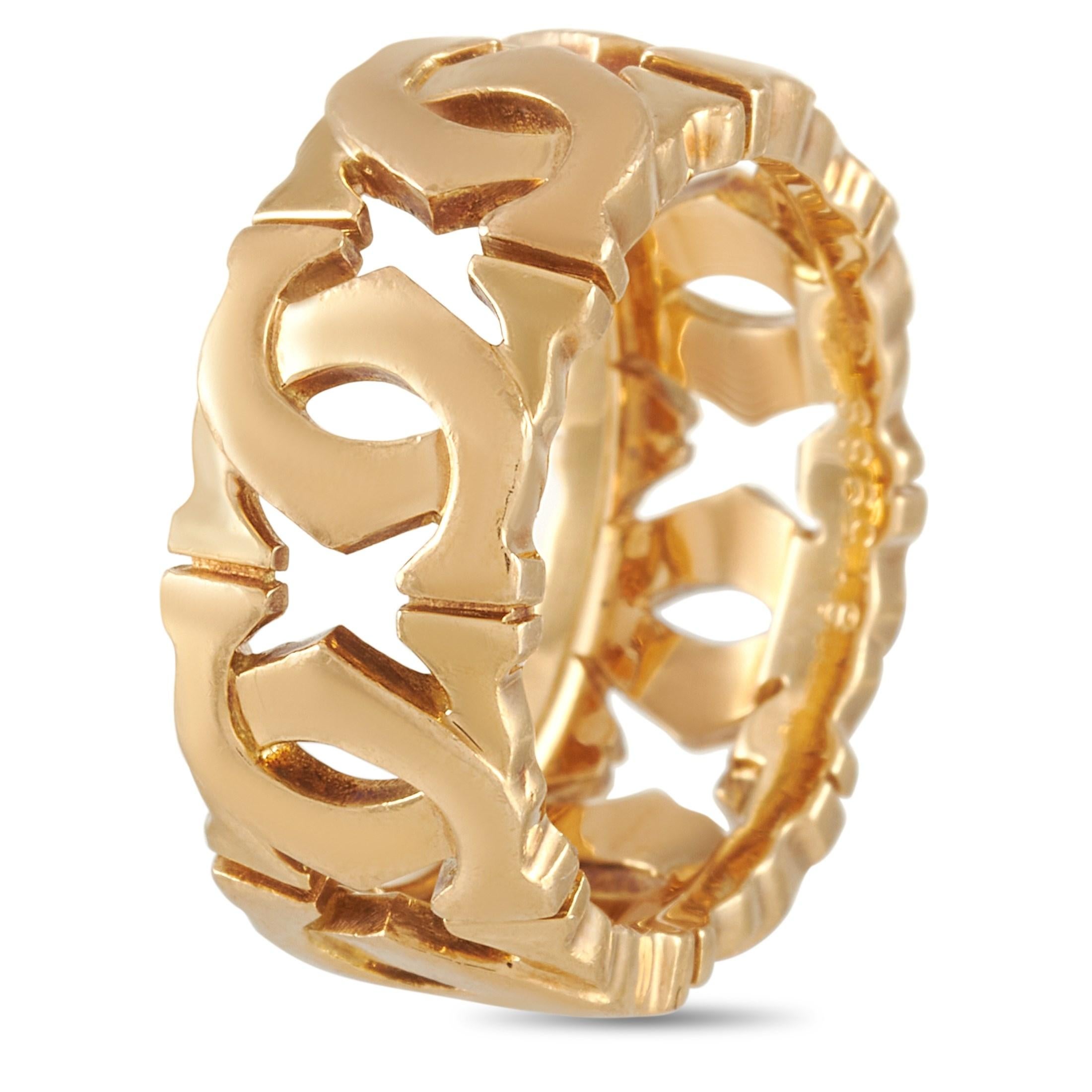 This unique 18K Yellow Gold Cartier Double C Ring will have people doing a double-take to catch another glimpse of it. The band is made with 18K Yellow Gold and features a pattern of interlocking openwork C's throughout. The ring has a band