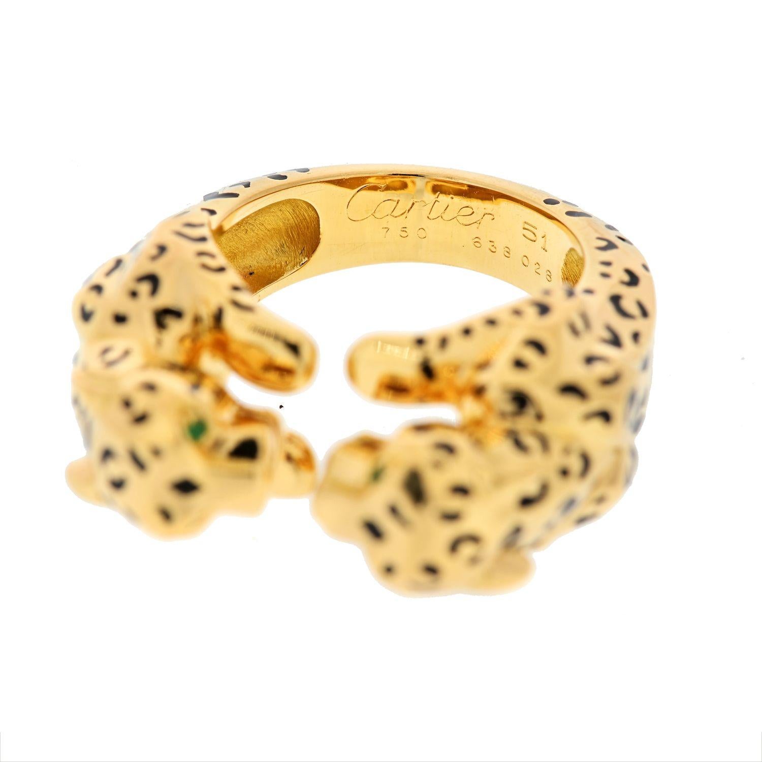 The beauty of wild cats is captured in this striking pre-owned Cartier design. Crafted in 18kt yellow gold, this ring is detailed with black enamel and boasts a double panther motif. Add a ferocious, feline flair to your look.

The ring is composed