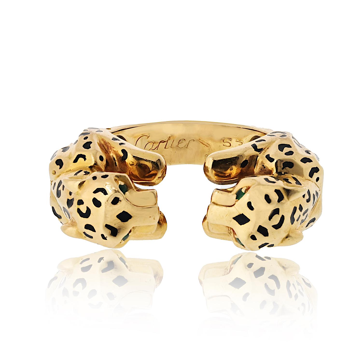 The beauty of wild cats is captured in this striking pre-owned Cartier design. Crafted in 18kt yellow gold, this ring is detailed with black enamel and boasts a double panther motif. Add a ferocious, feline flair to your look.

The ring is composed