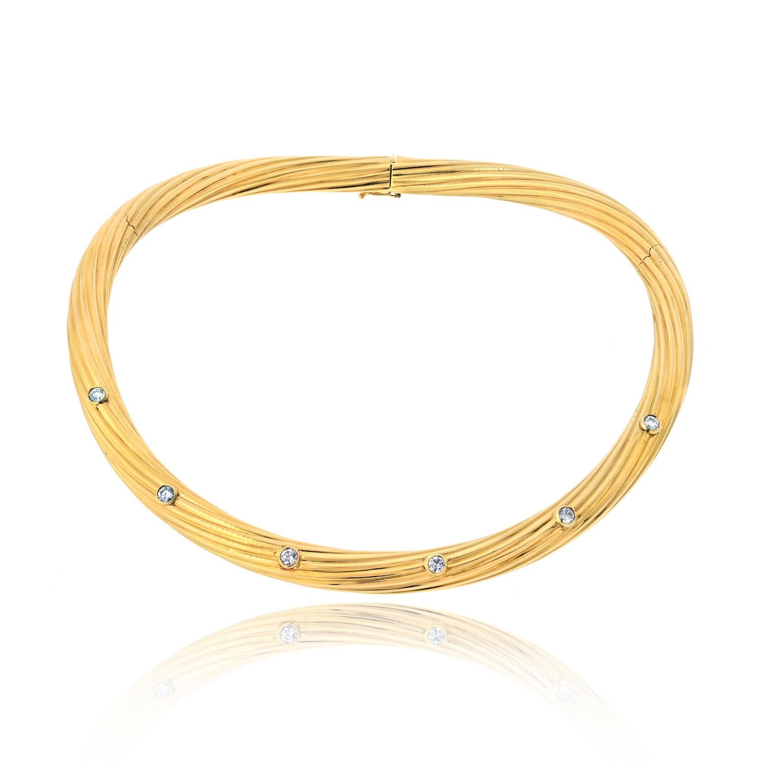 You are looking at the epitome of luxury and elegance: the Cartier 18K Yellow Gold Fluted Twist Diamond Choker Necklace. This stunning piece is a true masterpiece, meticulously crafted to exude sophistication and timeless beauty. Weighing a