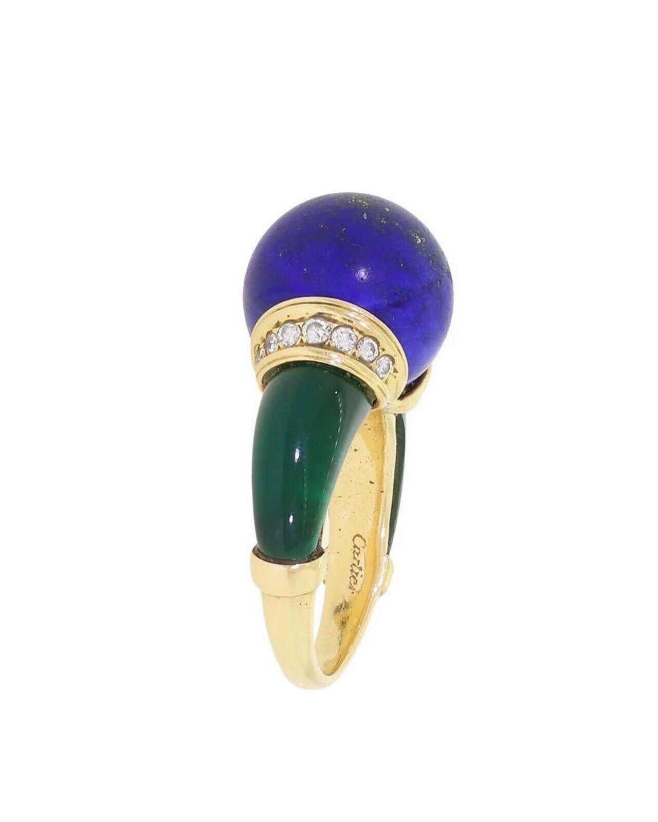 Cartier 18k Yellow Gold, Lapis, Diamond & Chrysoprase Egyptian Revival Ring.



Here is your chance to purchase a beautiful and highly collectible designer vintage ring. Truly a great piece at a great price!


Maker: Cartier

Markings: Cartier - The