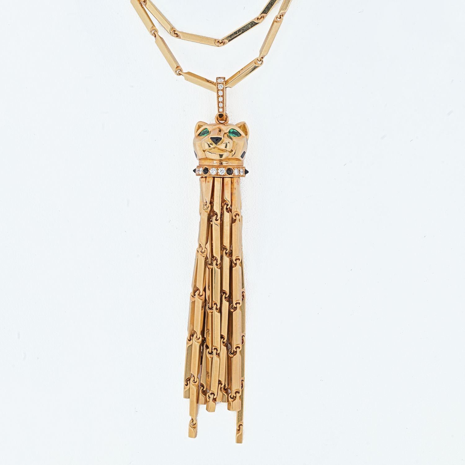 Cartier Panthere tassel pendant with black enamel, black onyx, and set with round diamonds, approx. 0.44 carats total weight, F/G color, VVS-VS clarity; and the eyes are set with pear-shaped emeralds; chain pendant engraved, Panthere bail engraved;