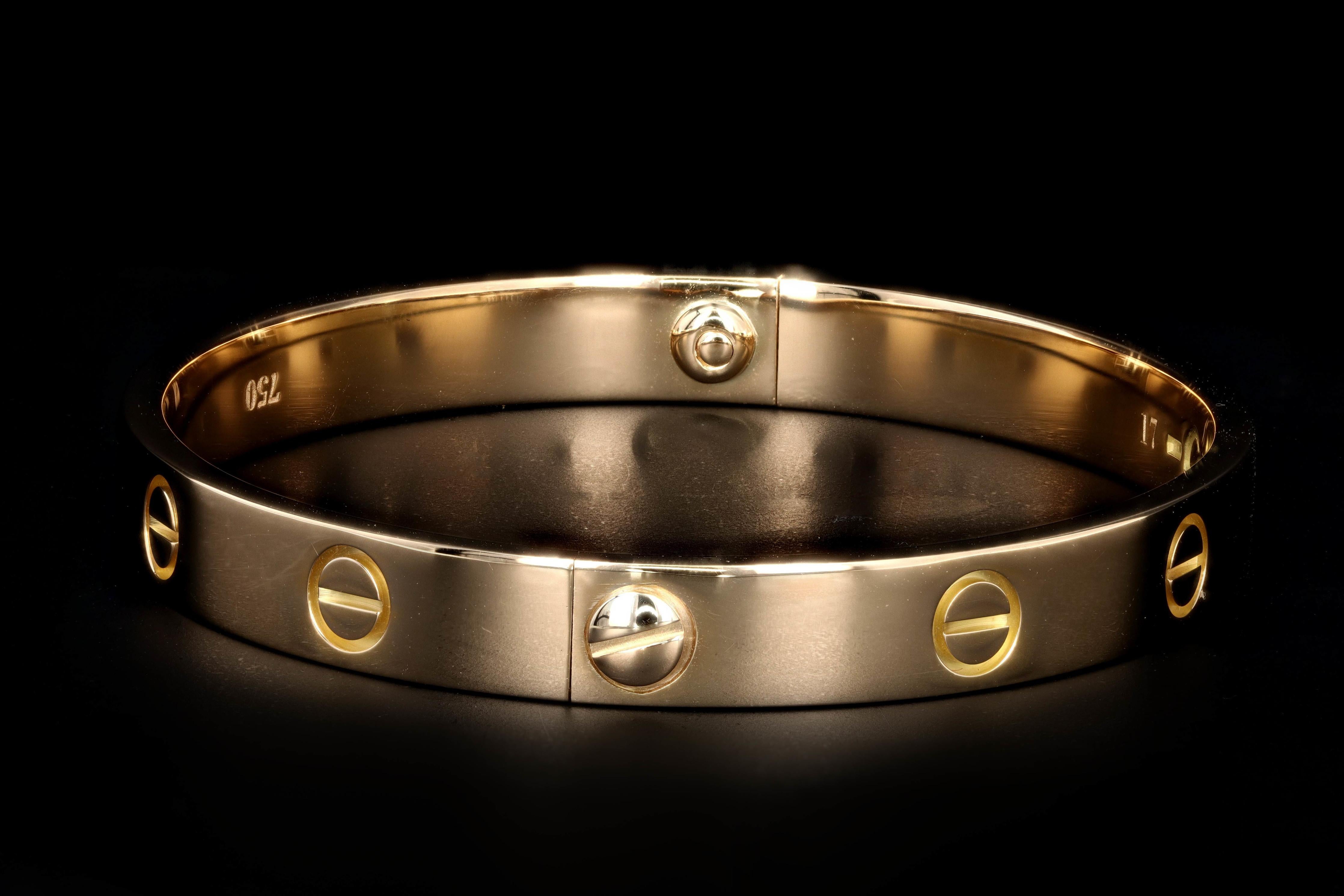 Era: Modern

Designer: Cartier

Composition: 18K Yellow Gold

Love Bracelet

Size 17

Comes w/ pouch & service papers 

Old screw system

Item Barcode: 448321