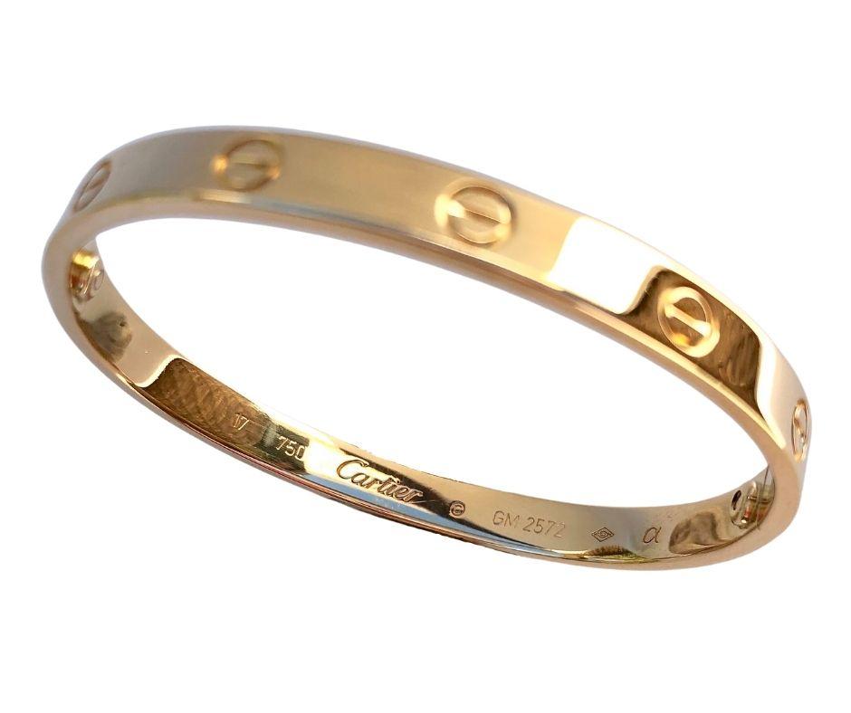 This pristine 18k yellow gold Cartier bangle from the iconic Love collection is complete with original 18k gold screwdriver, Cartier box and certificate. 

Size 17. Made in France, circa 2008. 

Weight: 33 g
Gold Width: 6mm
Gold Thickness: