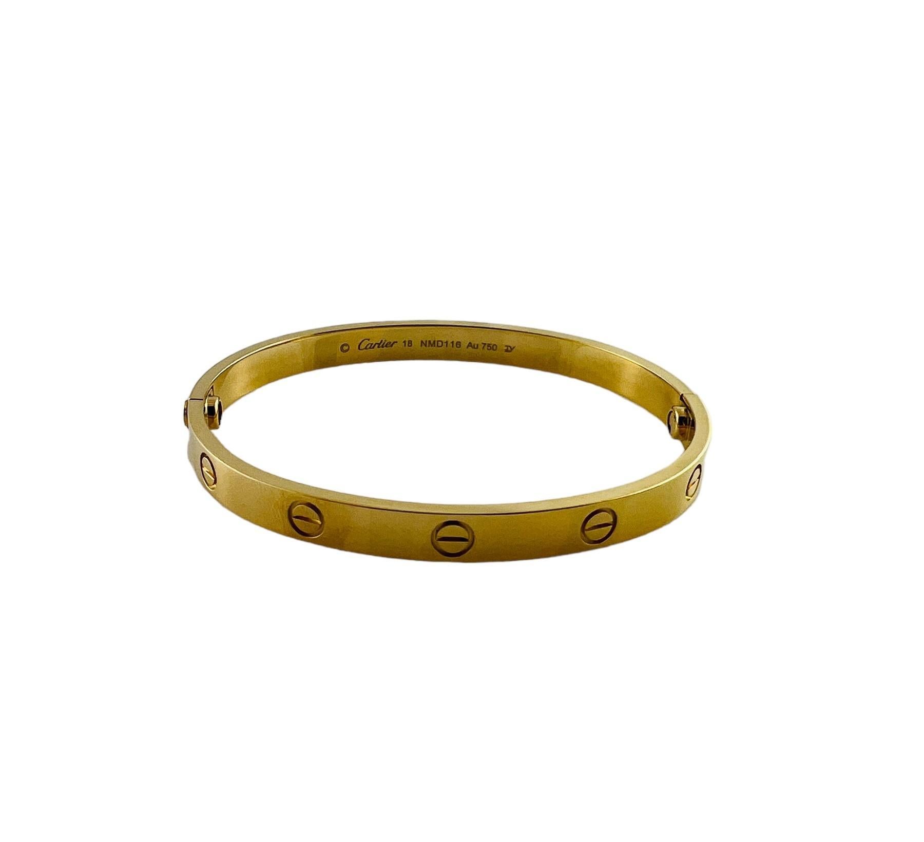 Cartier 18K Yellow Gold Love Bracelet

This beautiful authentic Cartier love bracelet comes with original inner and outer box, certificate, cleaning kit, booklet, screwdriver and gift bag

Cartier Size 18

approx. 6mm wide

Stamped Cartier 18 NMD