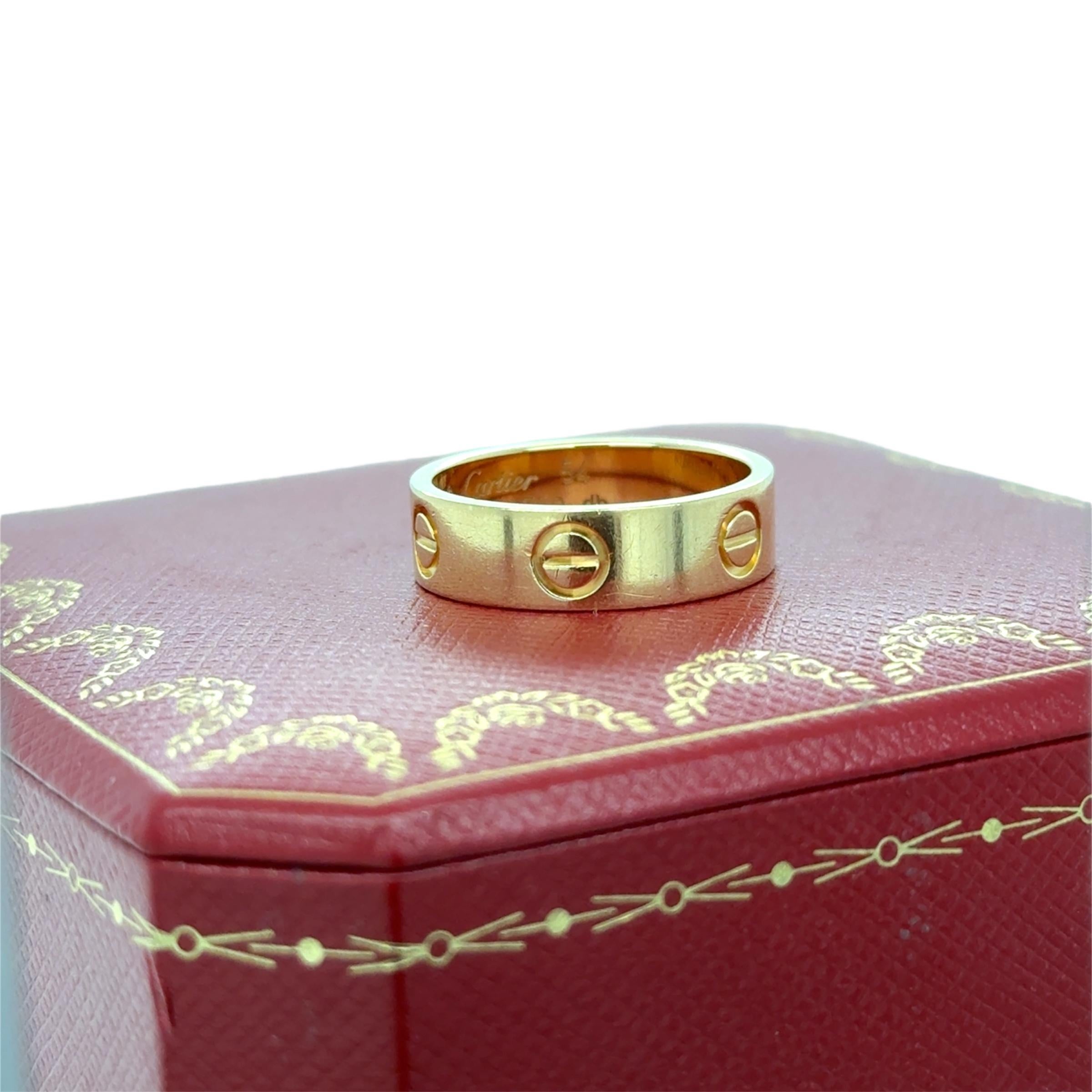 Cartier Love Ring
Classic Model
Stamp: Cartier 54 (Cartier serial number) Au750 db
Cartier Ring size: 54
Ring Size: 6 3/4
Material: 18 karat yellow gold
Gross weight: 6.10 grams

Accompanied by a Cartier box and receipt with folder.