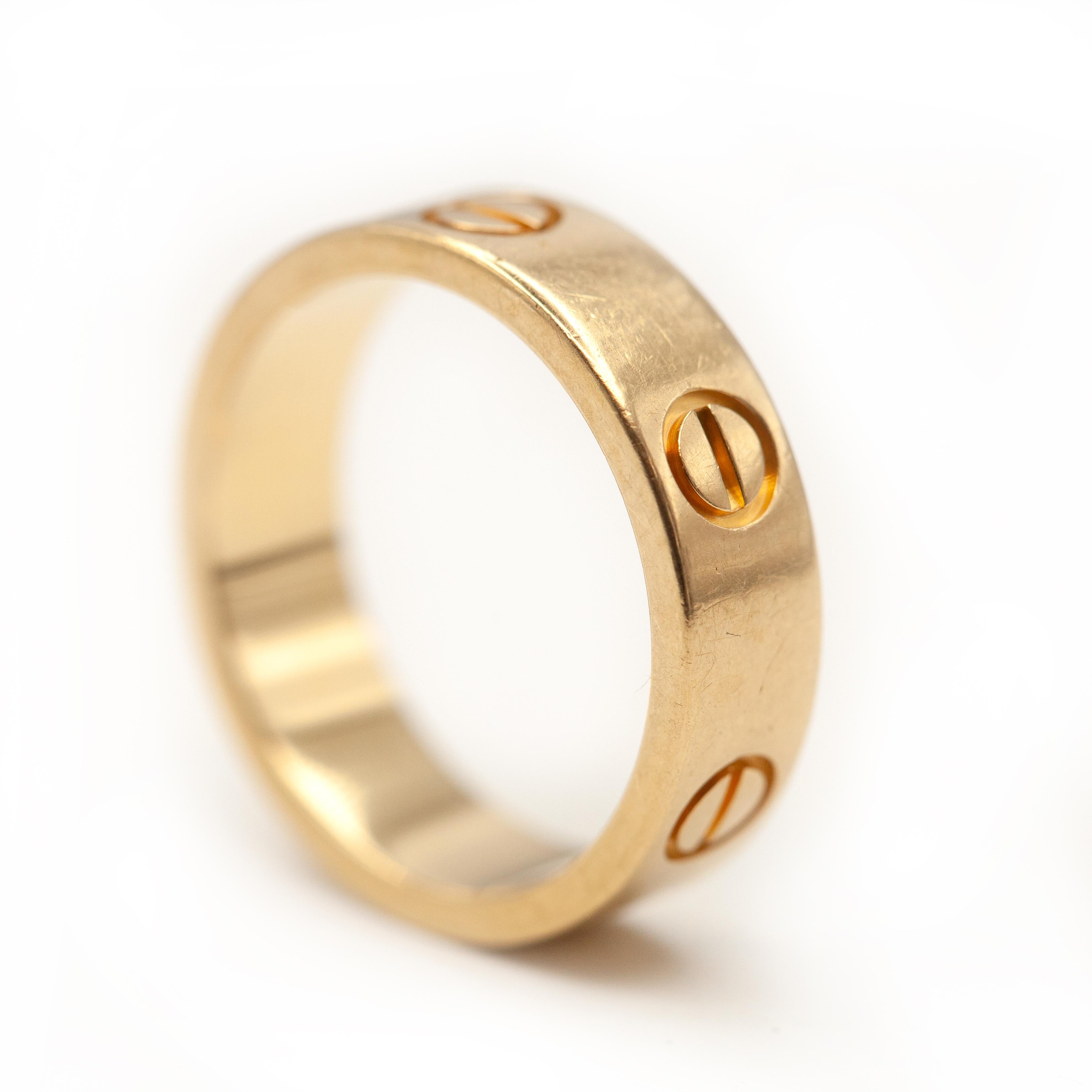 Cartier Love Collection 18K Yellow Gold Band Ring from 1990s

Ring Size: 54 (~US 6.75)

Approximate Weight: 7.4 grams

Appropriate Measurement:
Band Width - 5.5mm

Hallmarks: Cartier 750 54 Serial# and maker’s hallmark
