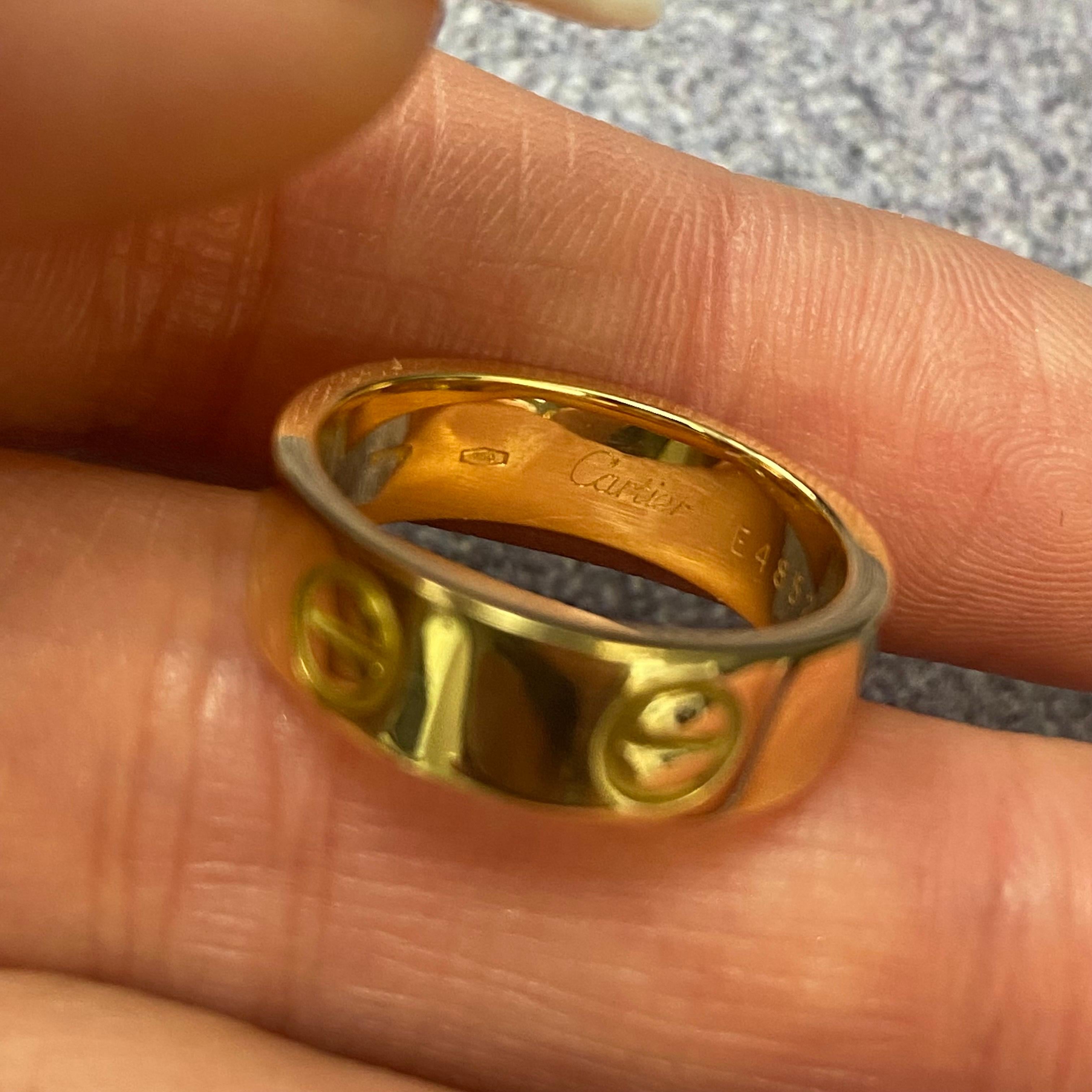 Cartier Love ring in 18K yellow gold. Ring size 50 US 5.25. Width: 5.5mm. Old style. The ring is in great condition. Original box and papers are not included. Comes with a presentable gift box.
