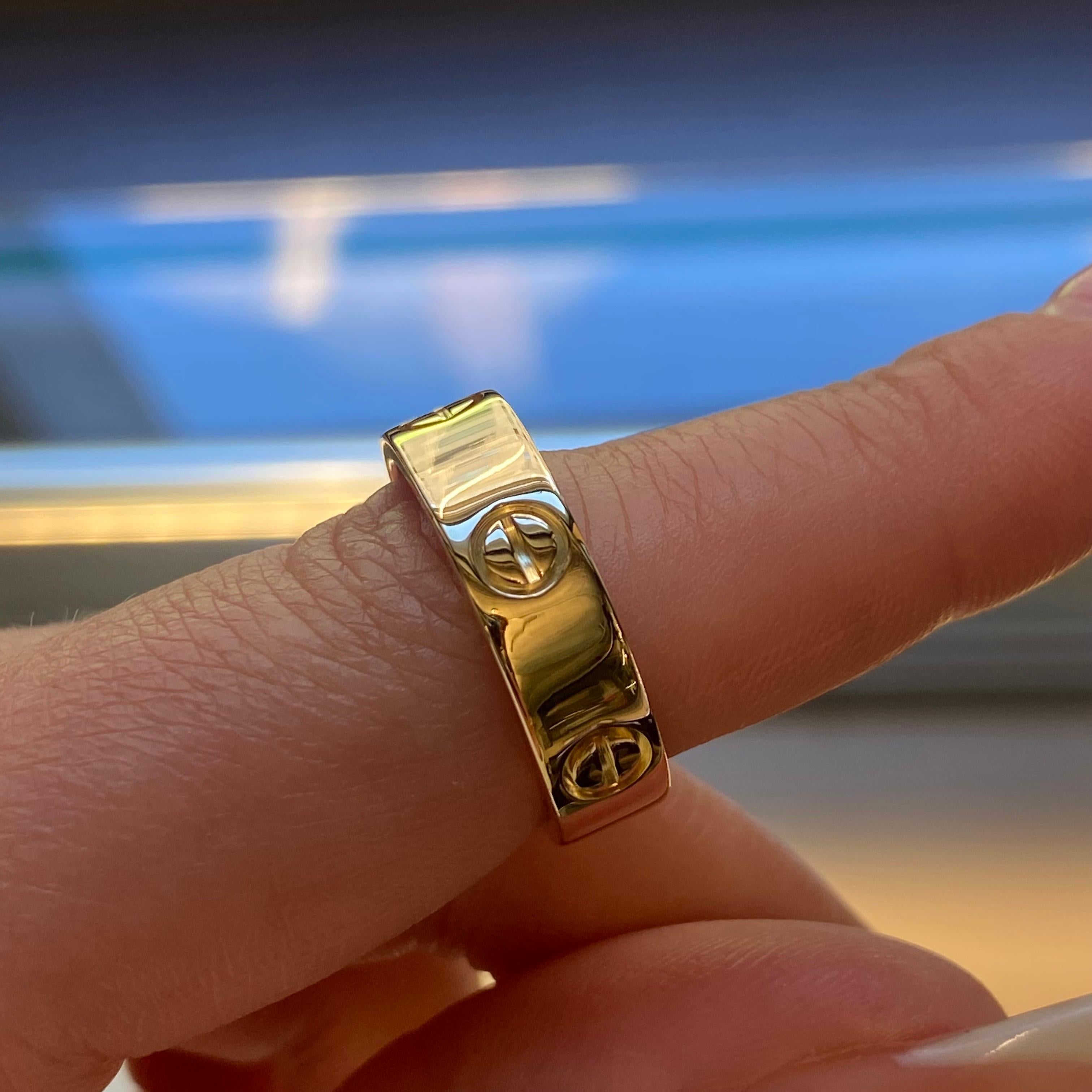 Cartier Love ring in 18K yellow gold. Ring size 57 US 8. Width: 5.5mm. Old style. The ring is in great condition. Original box and papers are not included. Comes with a presentable gift box.
