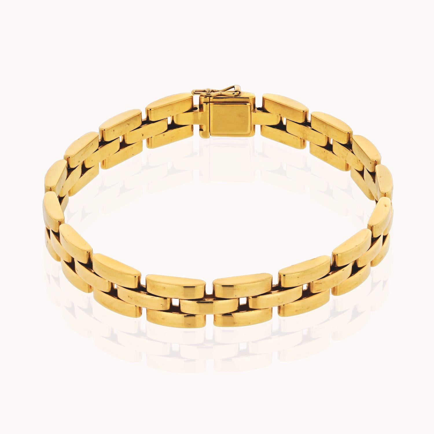 An 18k yellow gold Maillon Panthere bracelet by Cartier. The bracelet is made up of iconic flat 18k yellow gold solid links with a tongue clasp fastening. The bracelet measures 7 inches and has a gross weight of 40 grams. 
