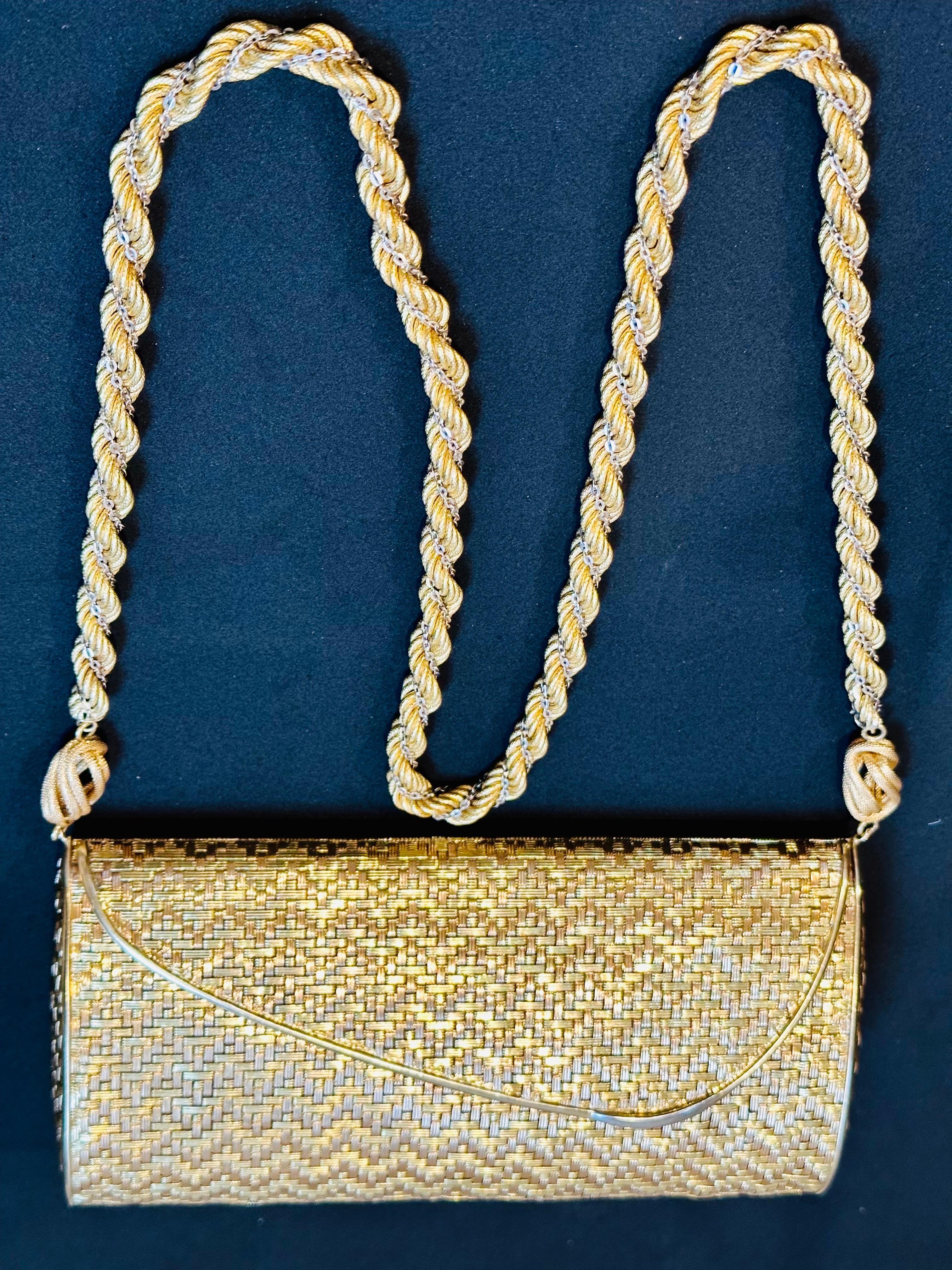 STUNNING AND RARE! 
Cartier, France 18 Karat Gold Evening Minaudière
This exquisite Vintage Clutch Purse from the 1960s was designed with a soft textured woven style,  Cartier  crafted in solid  18 Karat  yellow gold .
Meticulously crafted 18 karat