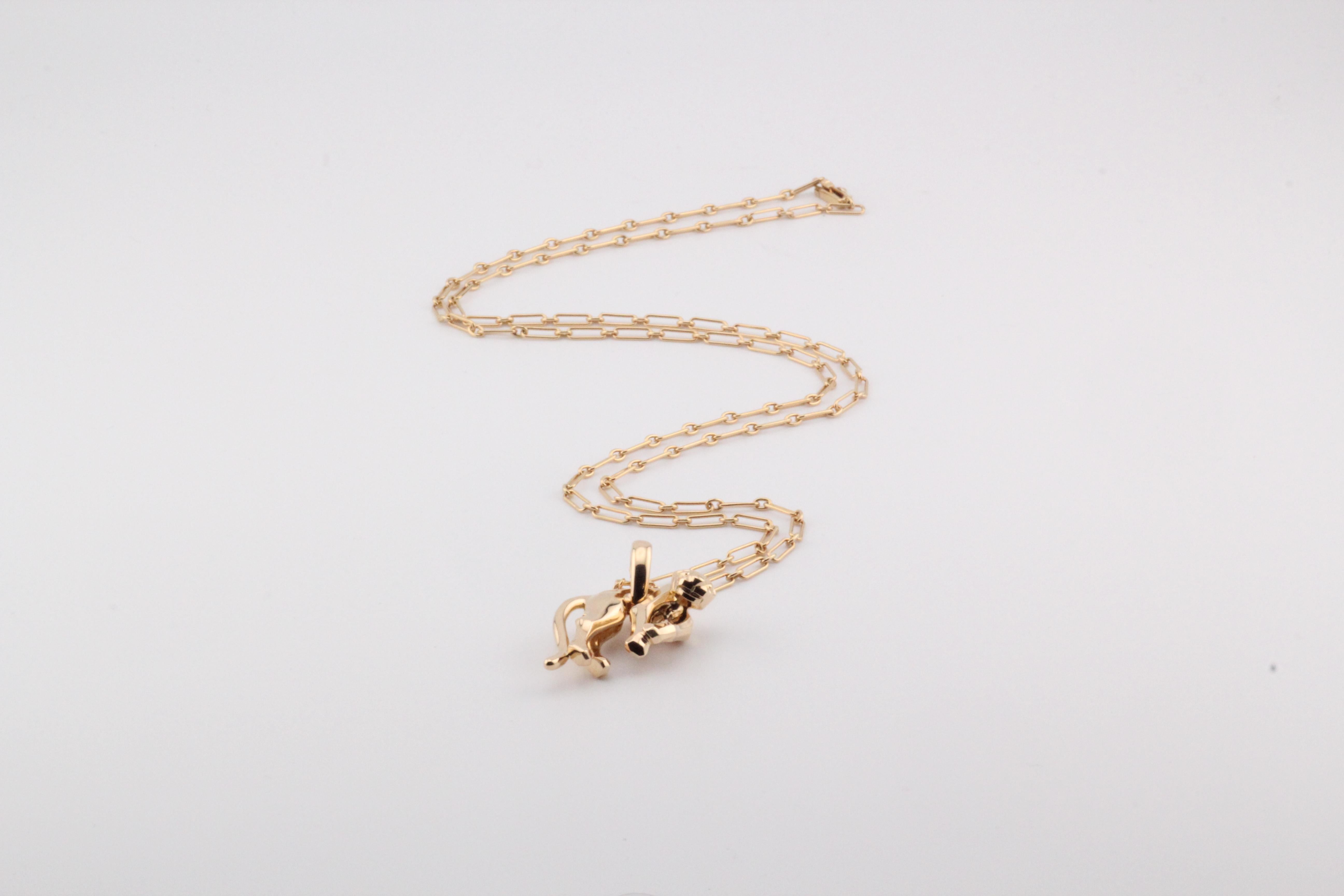 Indulge in the elegance of the Cartier 18k Yellow Gold Panther Pendant Long Chain Necklace, a stunning piece that embodies the luxury and artistry synonymous with the Cartier brand. This exquisite necklace features a meticulously crafted panther