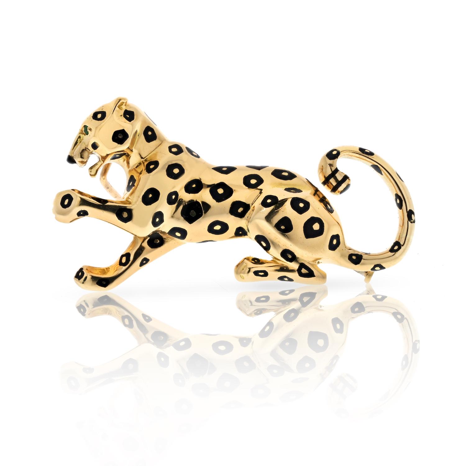 Show your fierce side with this Cartier panther pin. The iconic motif is crafted in high polish yellow gold with black enamel spots in a ferocious pose.

Length: 1.75 inches (approx.)
Height: 0.75 inches (approx.)
Fully hallmarked, Cartier serial