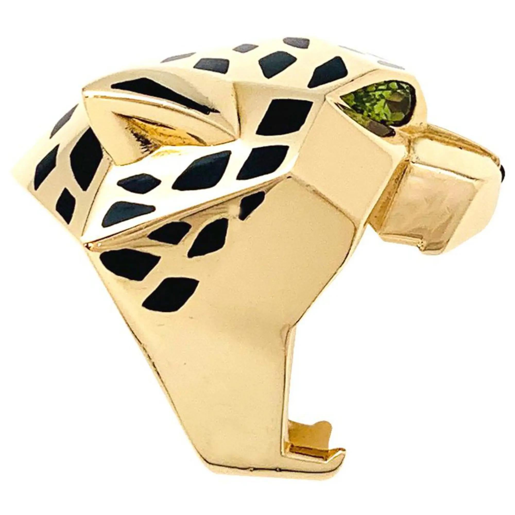 Cartier's Panthere de Cartier ring, 18K yellow gold set with black Lacquer, Peridots and Onyx. Panthere is the symbolic animal of Cartier, made its first appearance in the Maison's collections in 1914. Width of the pattern according to metrics: 29.7