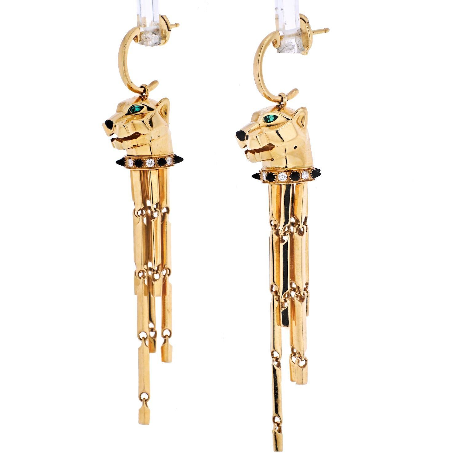 A spectacular pair of 18k yellow gold Cartier earrings from the Panthere de Cartier collection. The earrings comprise of a Panthere's head, with tsavorite set to the eyes and black onyx to the nose. The Panthere has round brilliant cut diamonds and