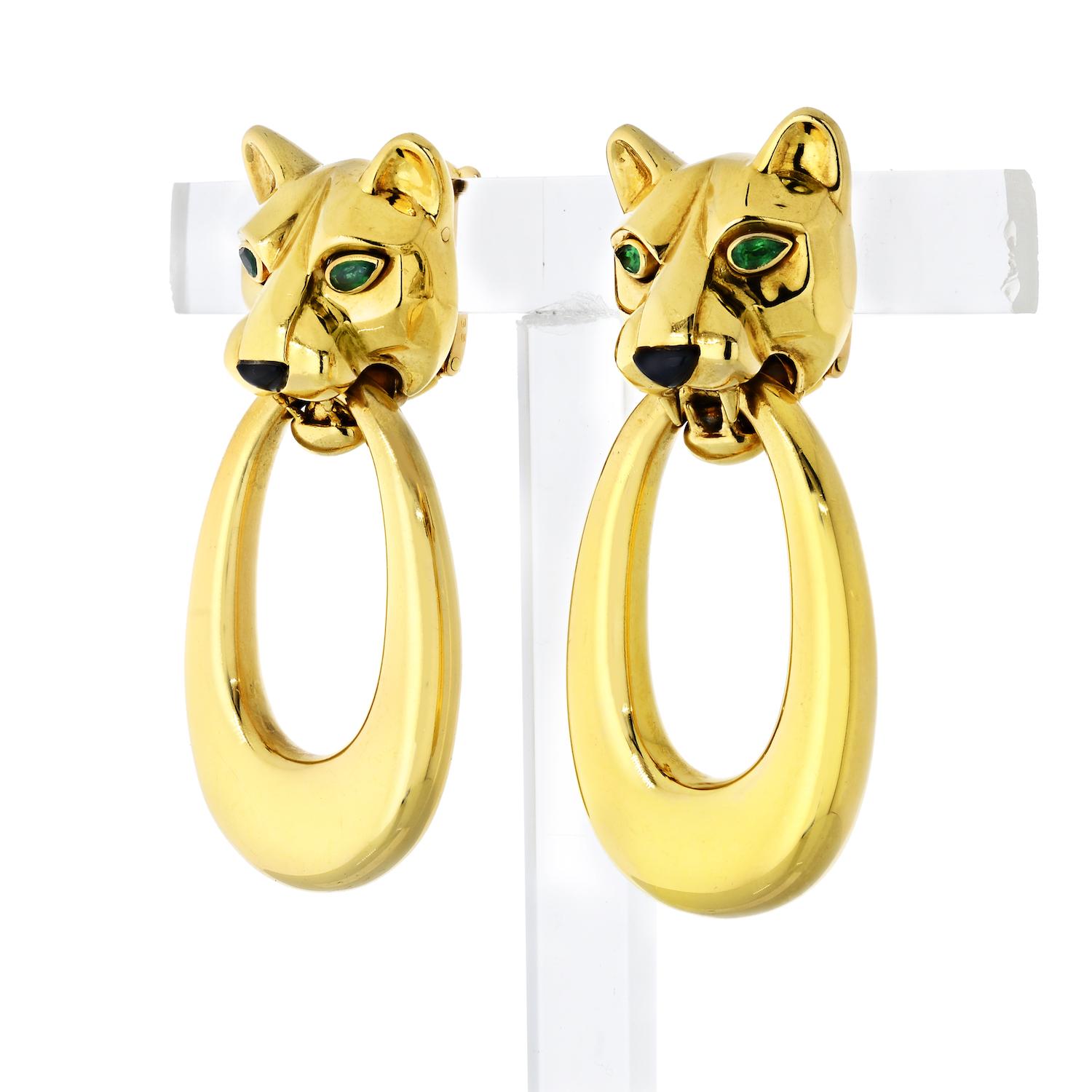 Exquisite pair of Cartier door knocker style panthere earrings. These are classic and versatile earrings that are no longer in production. They allow the wearer the option to remove the loops and wear pantheres on their own. The earrings are signed