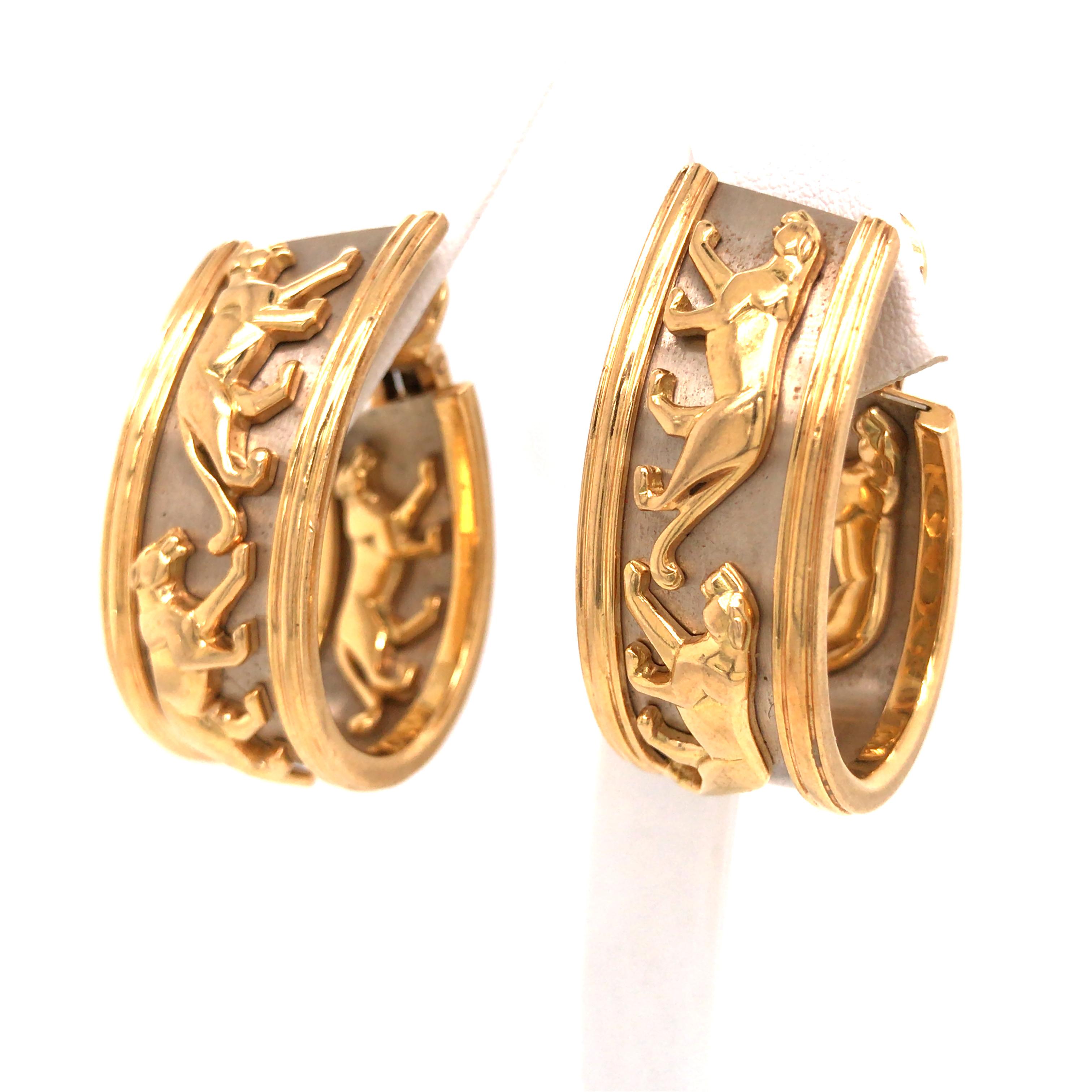 Cartier 18k Yellow Gold Panthere Hoop Earrings.  The Earrings measure 1 3/8 inch in length and 1 inch in width.  Clip on/off closure. 46.56 grams.  Signed, stamped 750 and serial number.
