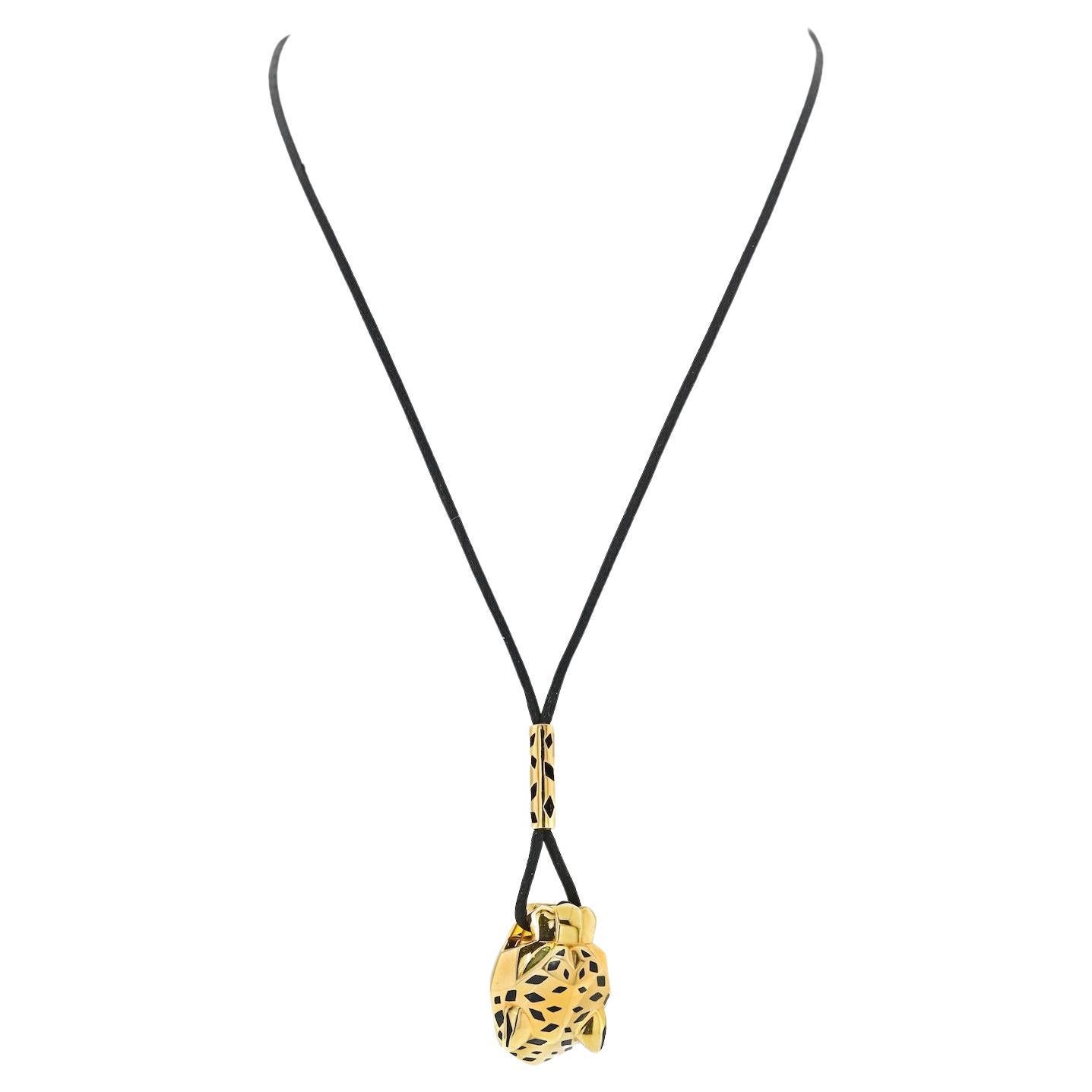 Cartier: 18 Karat Gelbgold Panther-Halskette mit schwarzer Kordel