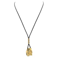 Cartier: 18 Karat Gelbgold Panther-Halskette mit schwarzer Kordel