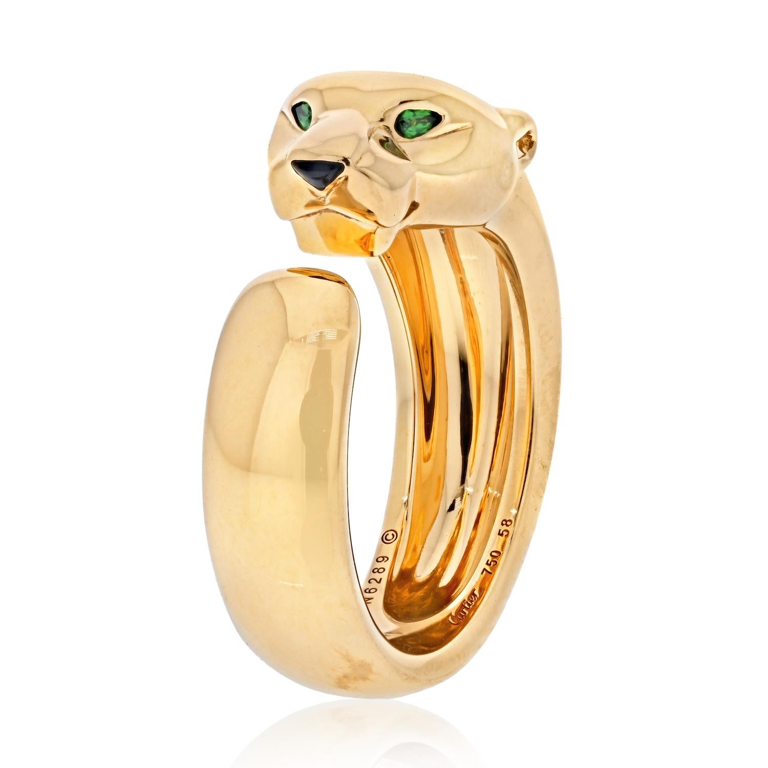 The Cartier 18K Yellow Gold Panthère de Cartier Ring is a stunning and versatile piece that seamlessly combines luxury with everyday wearability. Let's delve into the details:

**Design:**
- **Panthère Motif:**
  The ring features the iconic