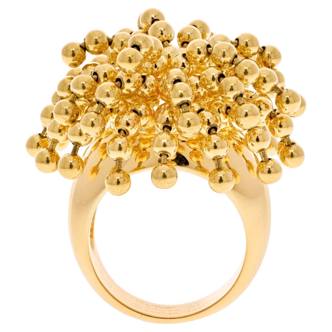 Cartier 18K Yellow Gold Paris Nouvelle Vague Articulated Bead Ring.

Absolutely adorable and oh so fun this staple of an accessory from Cartier is a must-have in every Cartier addict jewelry box.  Made of cascading cluster of movable beads this ring