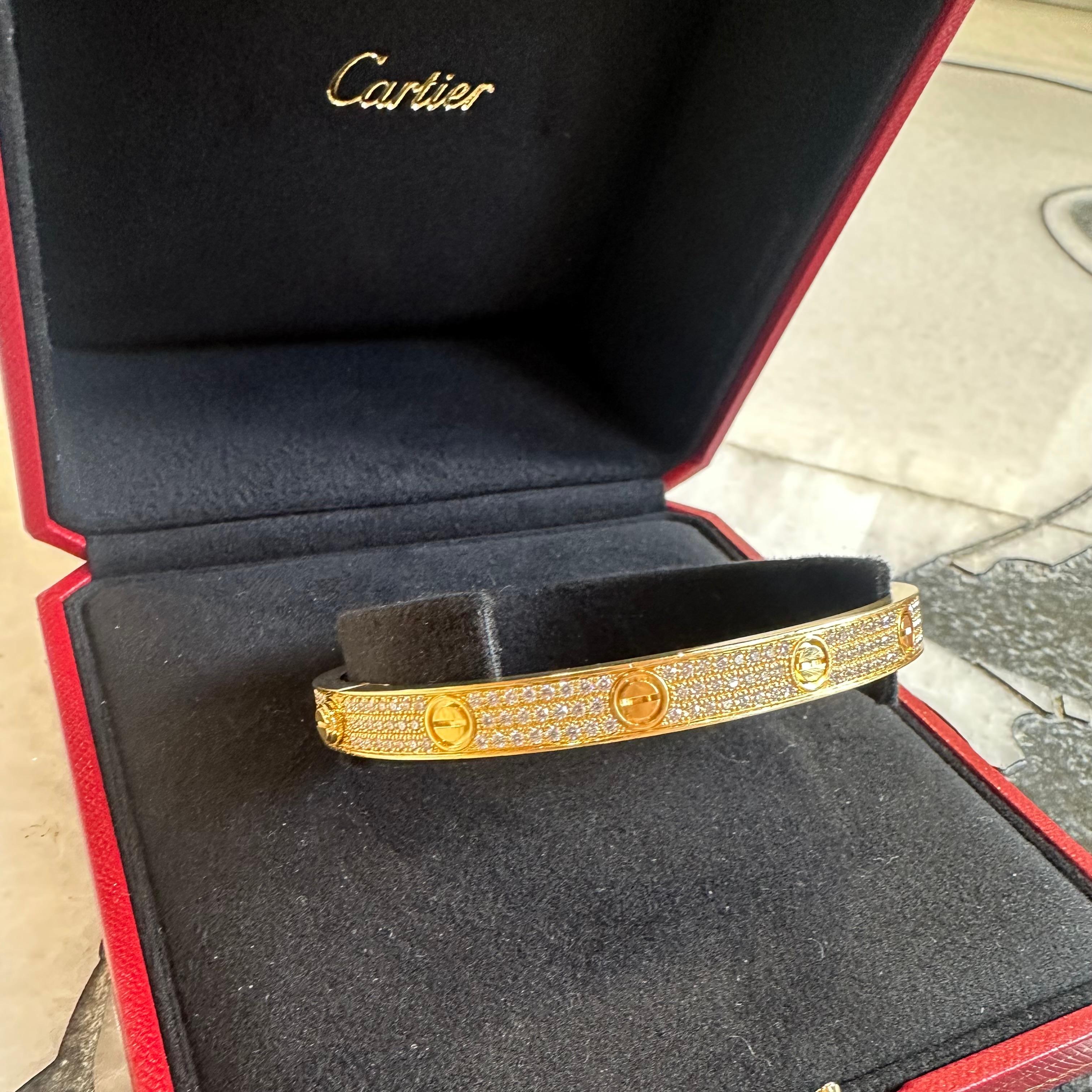 This Cartier yellow gold pave diamond bracelet in size 20 is in excellent conditions . Totaling 2.00ctw of brilliant cut diamonds that transforms this iconic model symbol of love and commitment into an exceptional jewelry piece.
It comes with