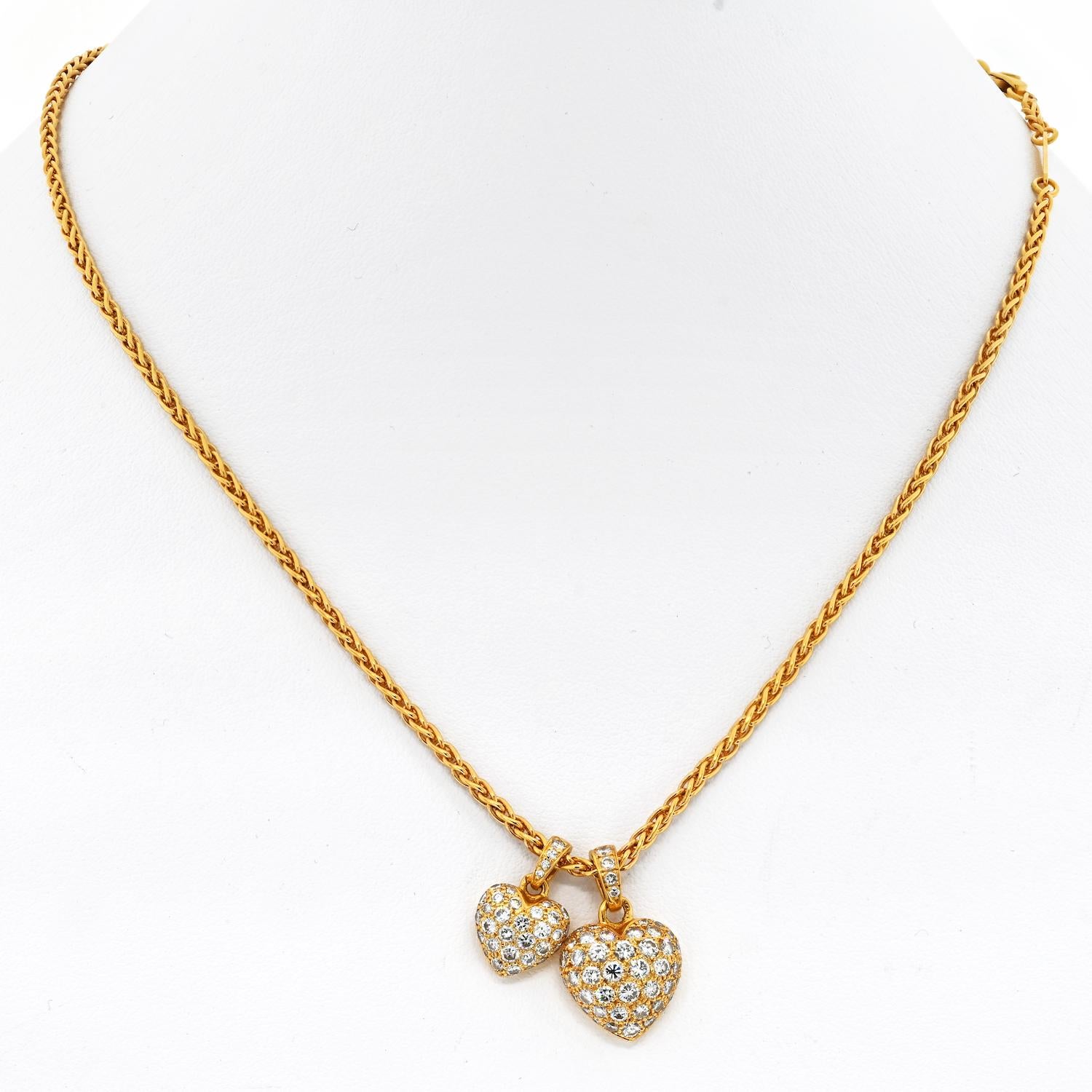 This beautiful Vintage Cartier 18K Yellow Gold Necklace features two pave set diamond heart-shaped pendants. 

Large Heart:
Measurements: 13.5mm x 22mm (with bail)

Small Heart:
Measurements: 10.4mm x 15.5mm (with bail)

Cartier weave chain length: