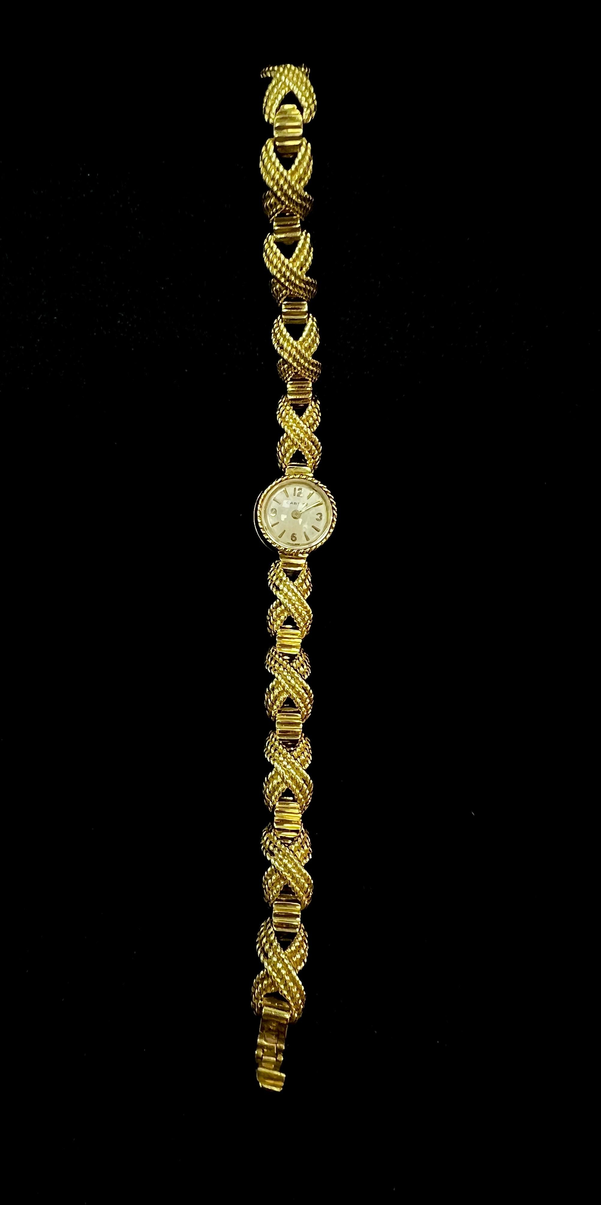 Cartier 18k Yellow Gold Rope Bracelet Watch

This stunning Cartier's 18k yellow gold rope bracelet wristwatch, featuring a unique braided rope motif bracelet, a rare timepiece captures the essence of classic Cartier luxurious craftsmanship.