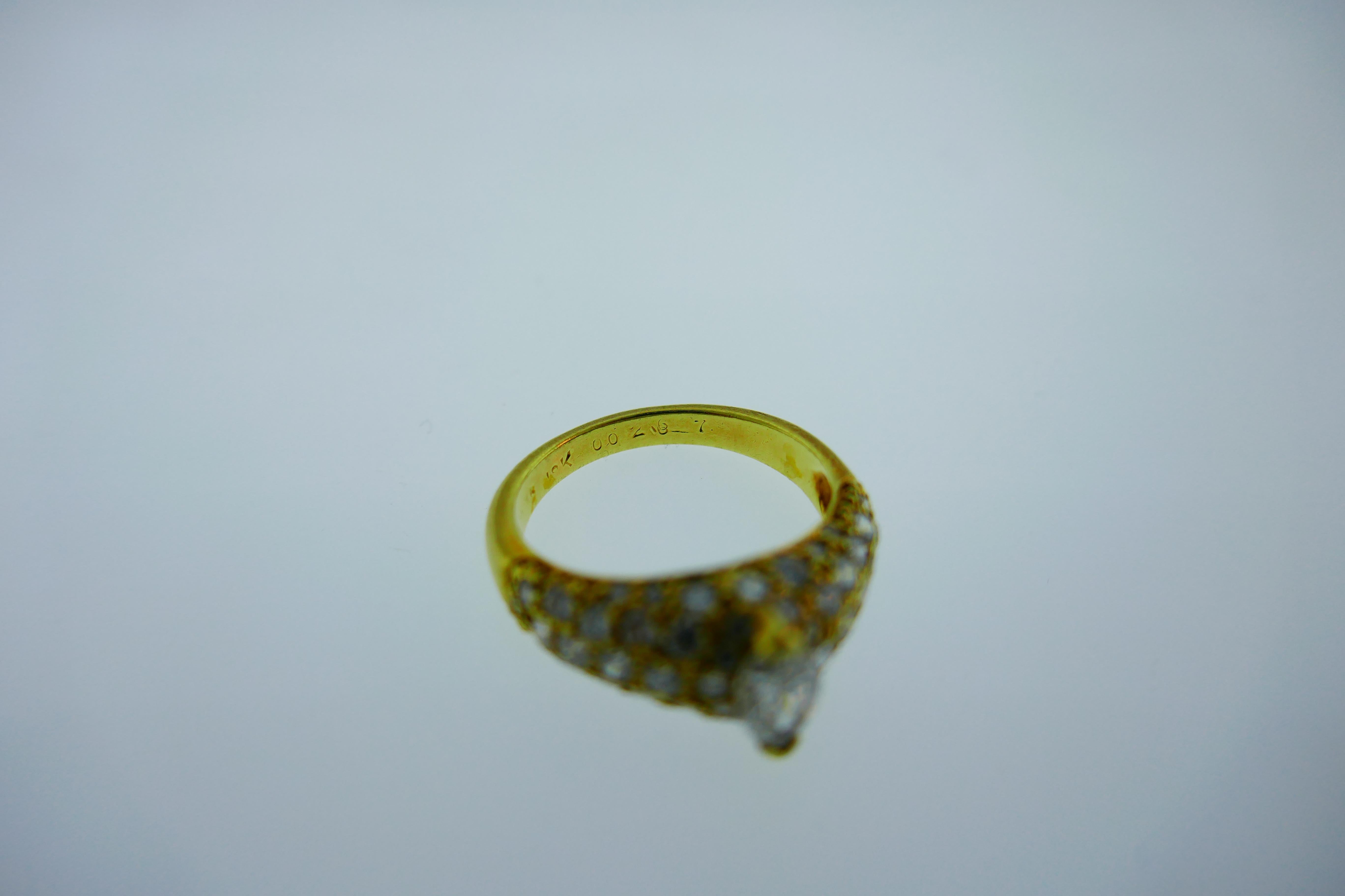 Women's or Men's Cartier 18 Karat Gold, Round Brilliant Cut Diamond and Marquise Cut Diamond Ring