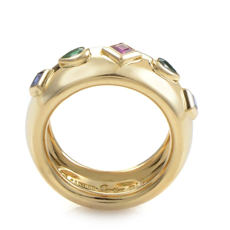 Precious gemstones stud this decadent ring from Cartier making it a real luxury to own. This band style ring is made of 18K yellow gold and is studded with two diamond-shaped sapphires, two pear-shaped emeralds, and one diamond-shaped ruby.
