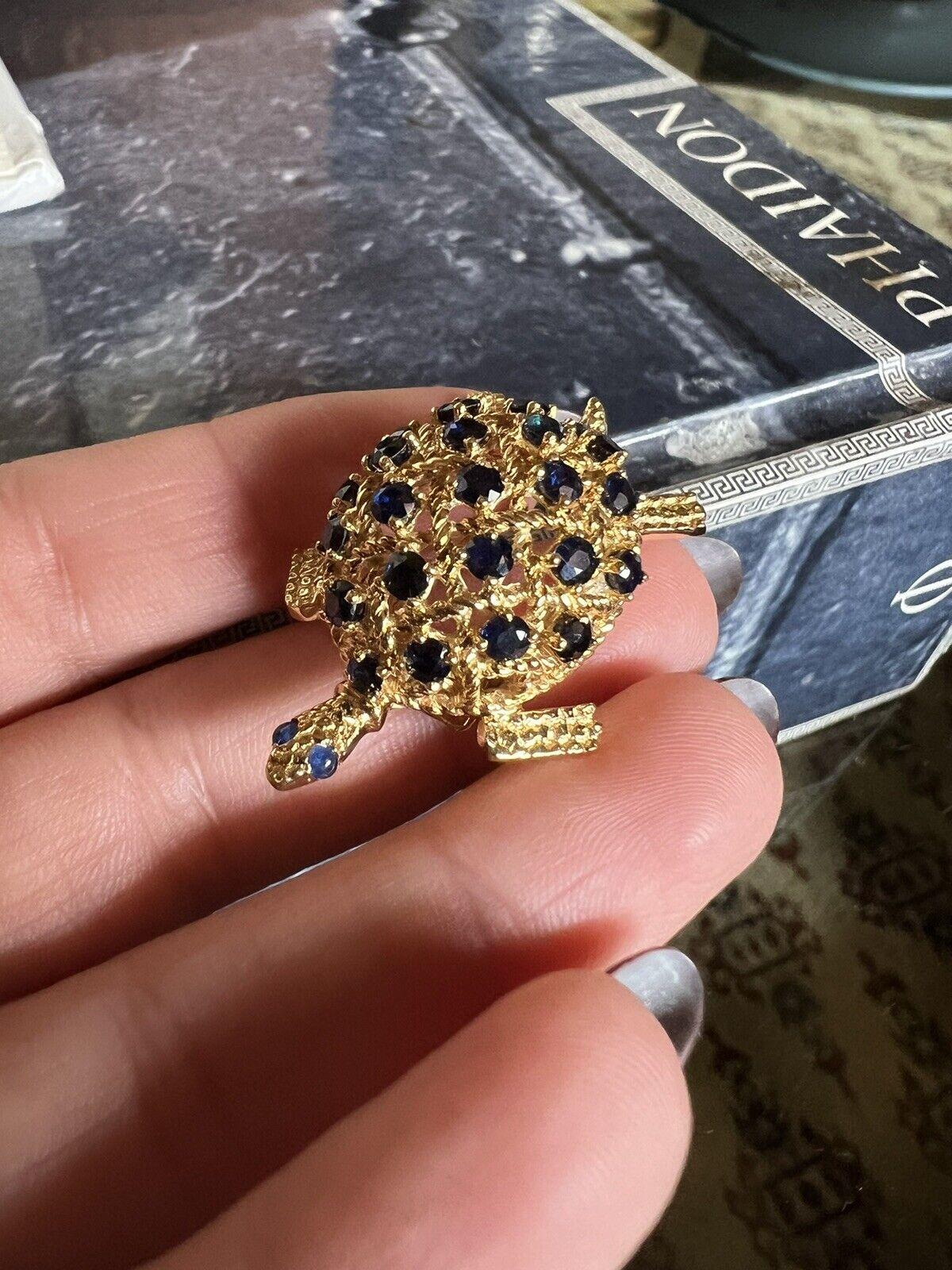 Cartier 18k Yellow Gold & Sapphire Turtle Clip / Brooch Retro Fully Hallmarked

Here is your chance to purchase a beautiful and highly collectible designer clip / brooch.  

There are 23 round sapphires, all natural.  The eyes are a lighter blue and