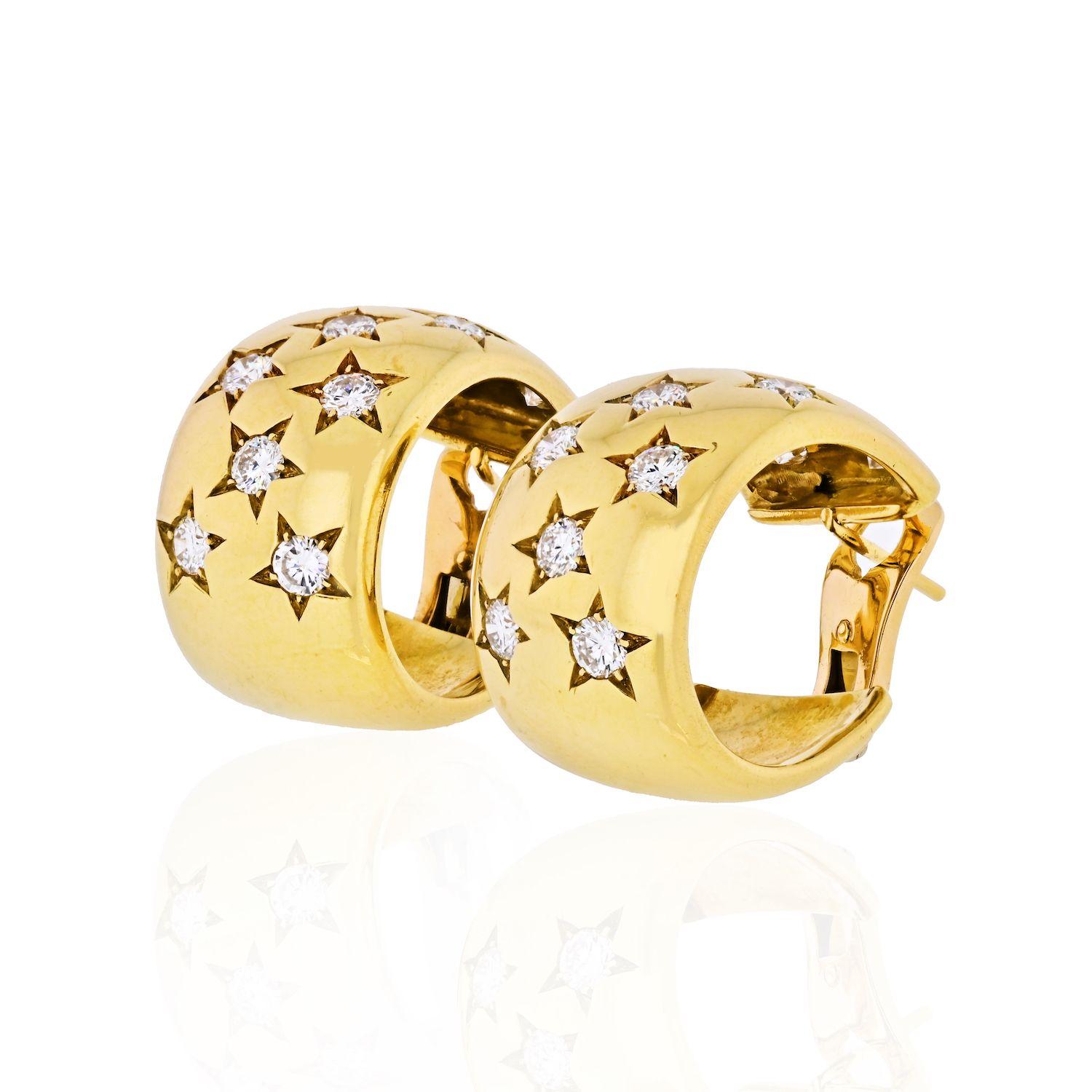 A pair of Cartier 18K yellow gold huggie style clip earrings having diamonds in star settings. The earrings are approximately 14.50 mm wide and approximately 24.00 mm in length. Circa 1970's. Diamond weight: 2.86cts. 14mm x 24mm.
