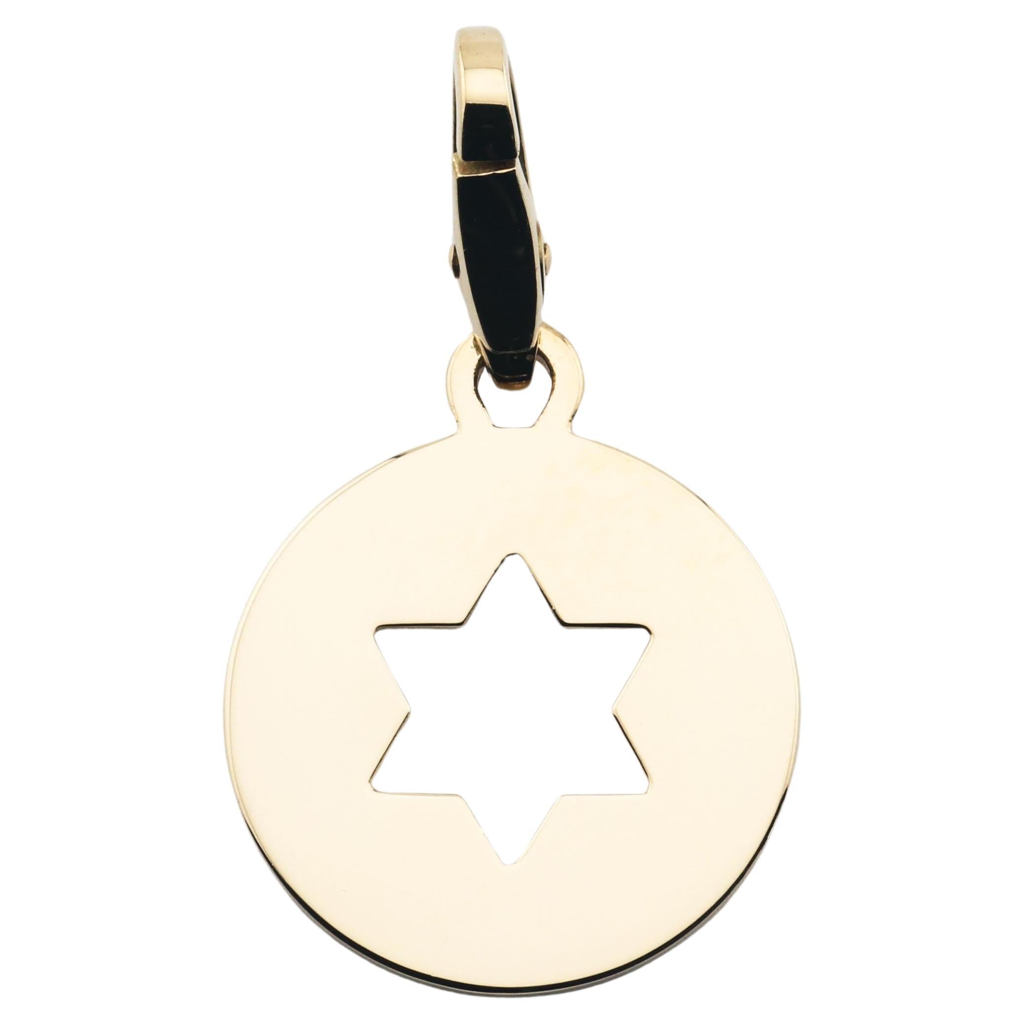 The Cartier 18K Yellow Gold Star of David Charm Pendant is a beautifully crafted piece that combines simplicity with deep cultural significance. This round charm is made from luxurious 18k yellow gold, exuding a warm, radiant glow that highlights