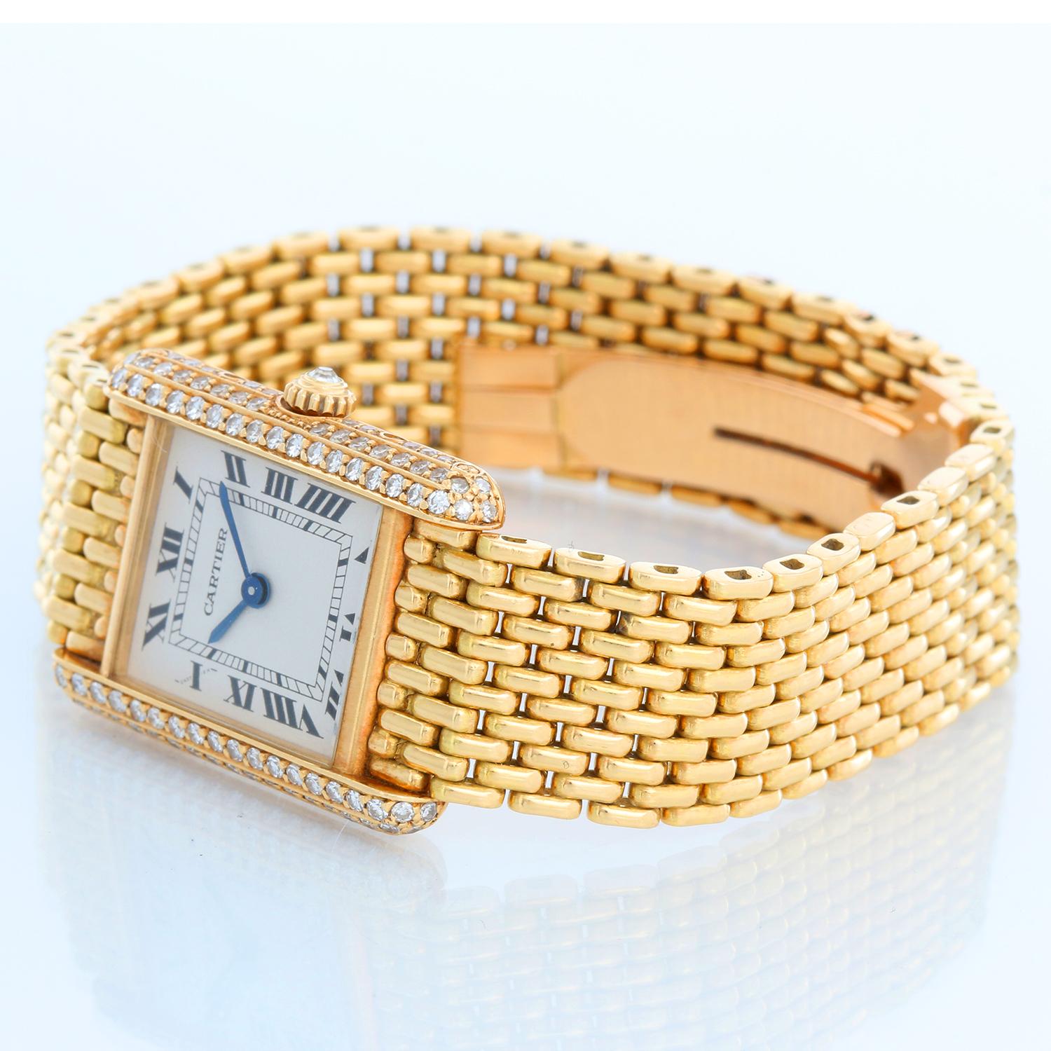 Cartier 18K Yellow Gold Tank Ladies Watch - Quartz. 18K yellow gold with diamond case ( 21 x 28 mm ). Silver tone dial with black roman numerals. Rice link bracelet with deployant clasp; will fit a 6 1/8 inch wrist. Pre-owned with custom box.