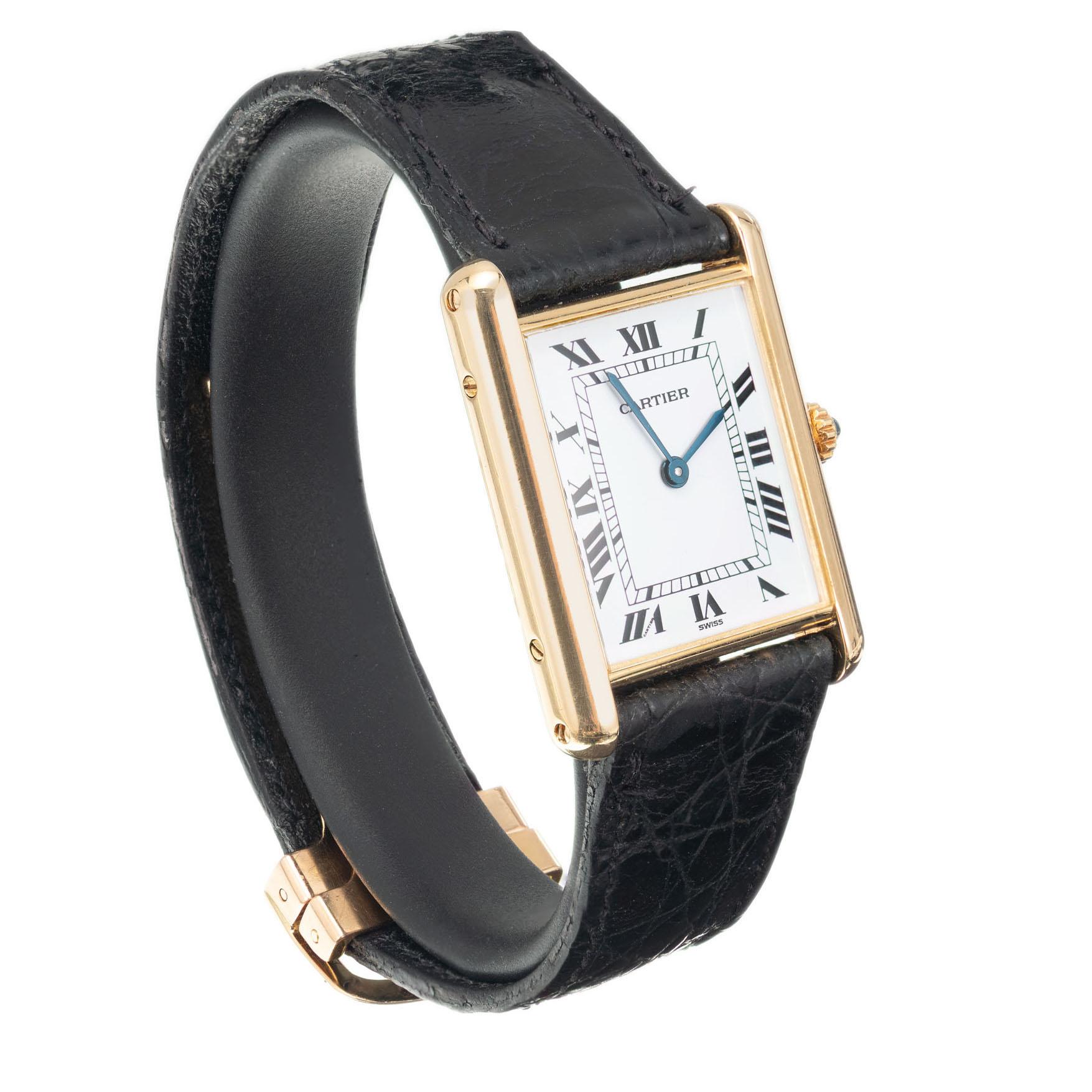 Cartier Tank Louis Quartz 18k yellow gold with Cartier band and 18k Cartier deployment buckle 

Length: 30.62mm
Width: 23.41mm
Band width at case: 17.52m
Case thickness: 5.54mm
Band: Black Cartier
Crystal: sapphire
Dial: white
Outside case: Cartier