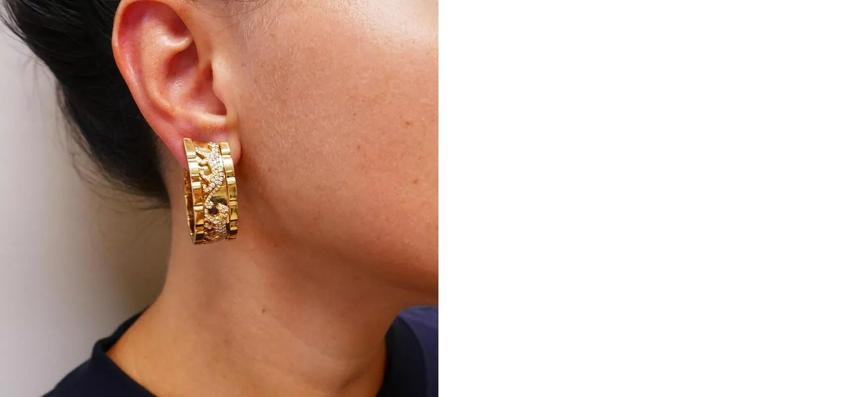 Cartier Walking Panthere Earrings, a true icon in the world of luxury jewelry. 

Crafted in 18k yellow gold, these earrings are designed as wide hoops, exquisitely depicting walking pantheres, Cartier's emblematic feline motif. 

The captivating