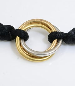Cartier 18 Karat Yellow Rose and White Gold Trinity Diamond Black Cord Bracelet