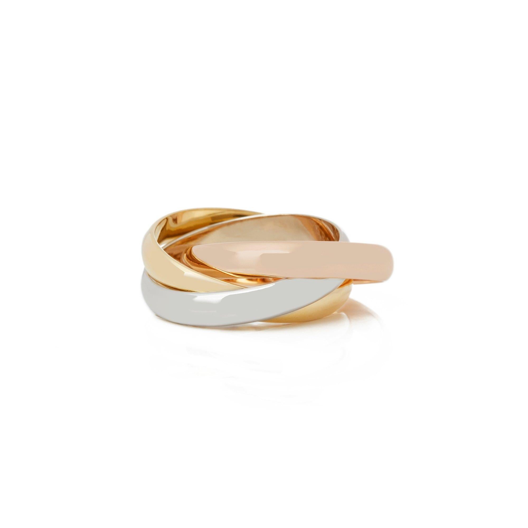 This Ring by Cartier is from their Trinity Collection and features Three Bands in 18k Yellow, White and Rose Gold. Ring Size UK M, EU Size 53, USA Size 6 1/2. Complete with Xupes Presentation Box. Our Xupes reference is COMJ209 should you need to