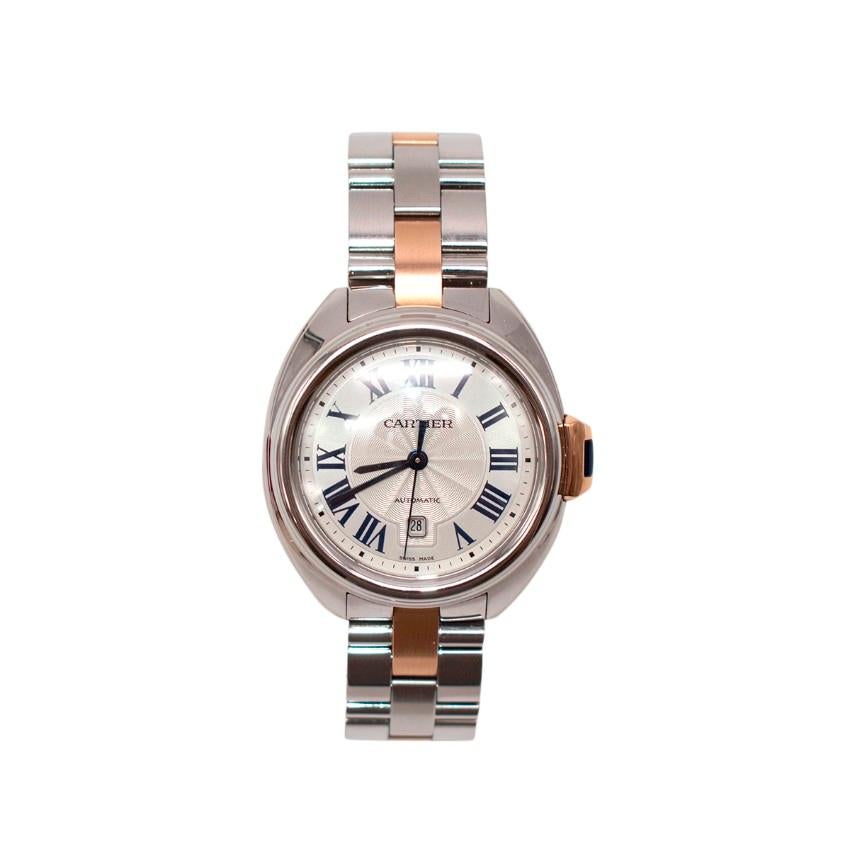 Cartier 18kt Rose Gold/Steel 32mm Cle de Cartier Watch

- Silver dial with roman numerals marking the hours
- Minute markers run along the outer rim of the dial
- A date indication widow is set at the 6 'o' clock position
- It uses the Cartier