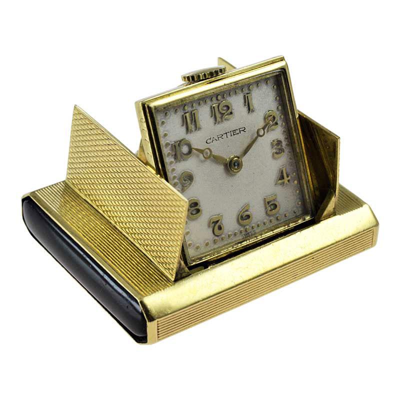 FACTORY / HOUSE: Cartier / New York
STYLE / REFERENCE: Travel Watch / Art Deco
METAL / MATERIAL: 18Kt. Solid Gold 
CIRCA / YEAR: 1930's
DIMENSIONS / SIZE: Length 43mm x Width 31mm
MOVEMENT / CALIBER: Manual Winding / 15 Jewels 
DIAL / HANDS: