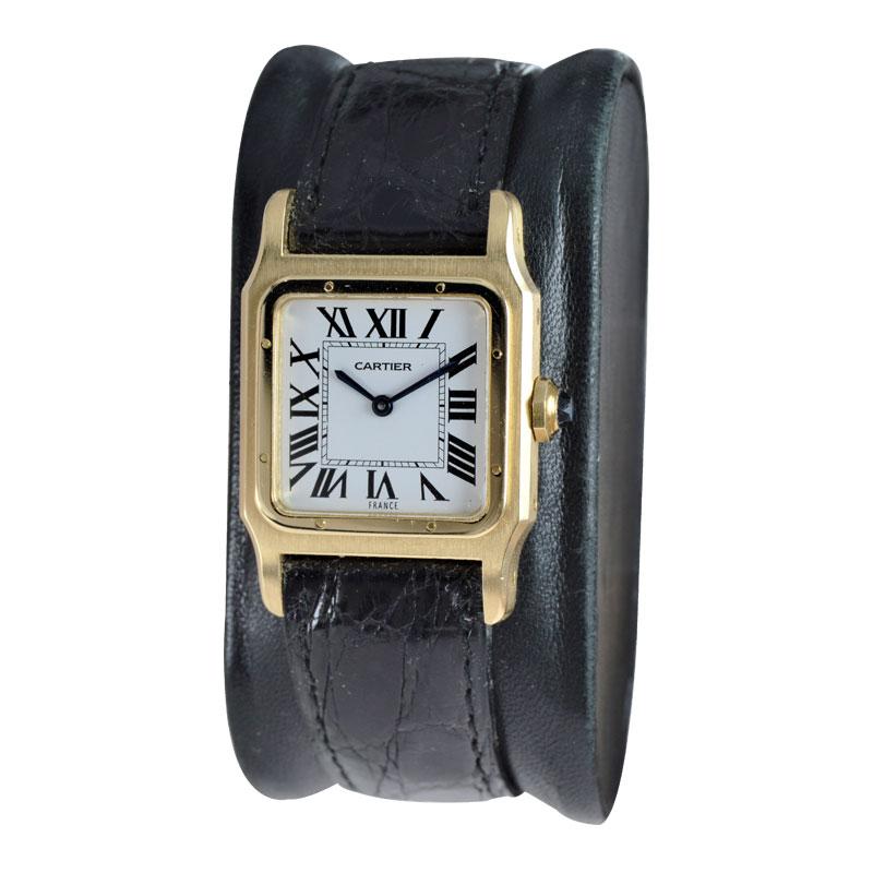 FACTORY / HOUSE: Cartier Watch Company
STYLE / REFERENCE: Santos Dumont 
METAL / MATERIAL: 18Kt. Yellow Gold 
CIRCA / YEAR: 1970's
DIMENSIONS / SIZE: 36mm x 25mm
MOVEMENT / CALIBER: Manual Winding / 17 Jewels / Caliber 75-1
DIAL / HANDS: Original