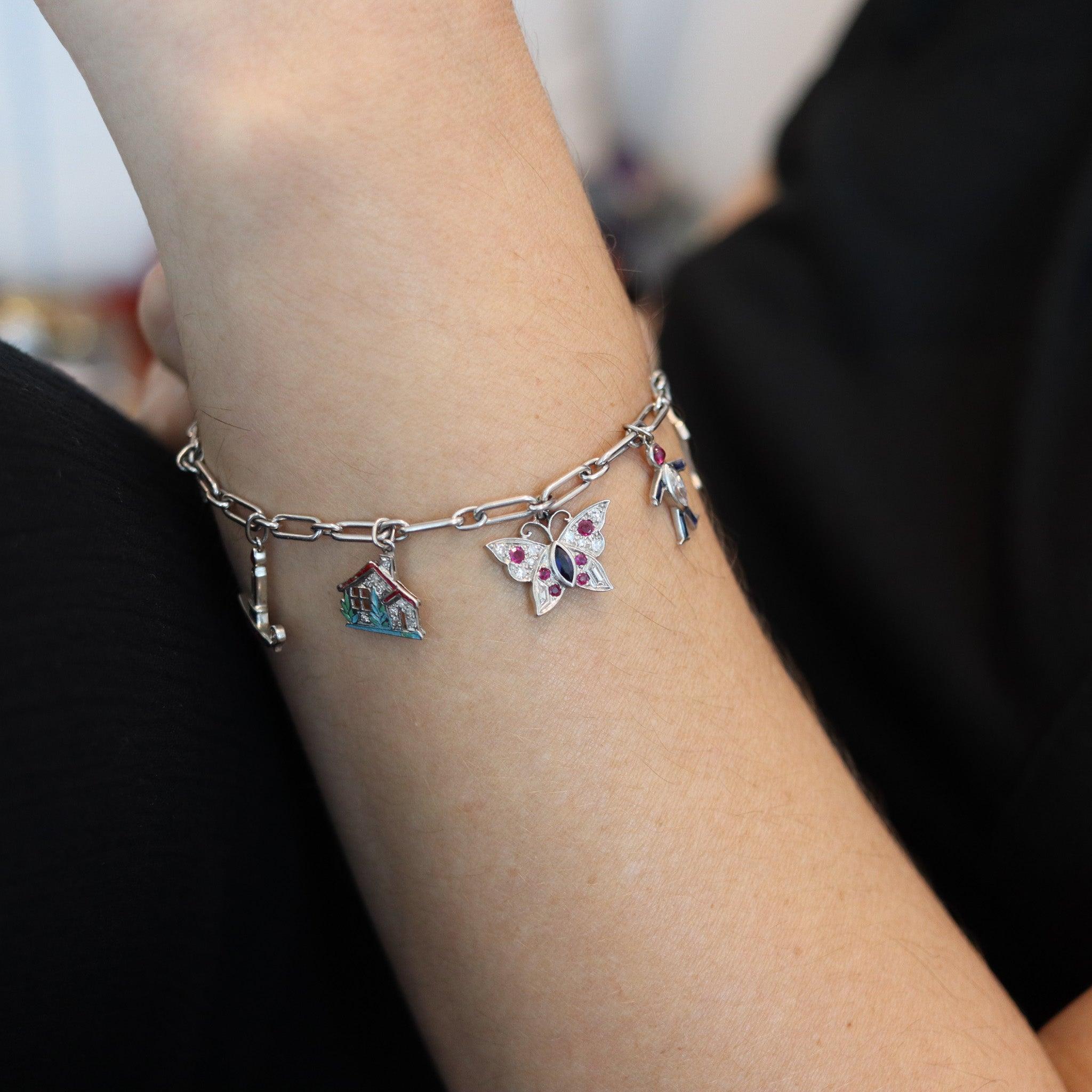An art deco nine-charms bracelet designed by Cartier.

This is a fabulous and extremely rare charm's bracelet, created in Paris France by the jewelry house of Cartier, back in the 1930. The charm's bracelet and the charms were designed and made