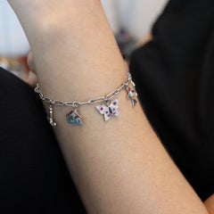 Cartier 1930 Bracciale Charms Art Deco in platino con 6,04 carati in diamanti e gemme