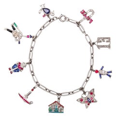 CARTIER 1930 Art Deco Charms Bracelet Platinum With 6.04 Ctw In Diamonds & Gems