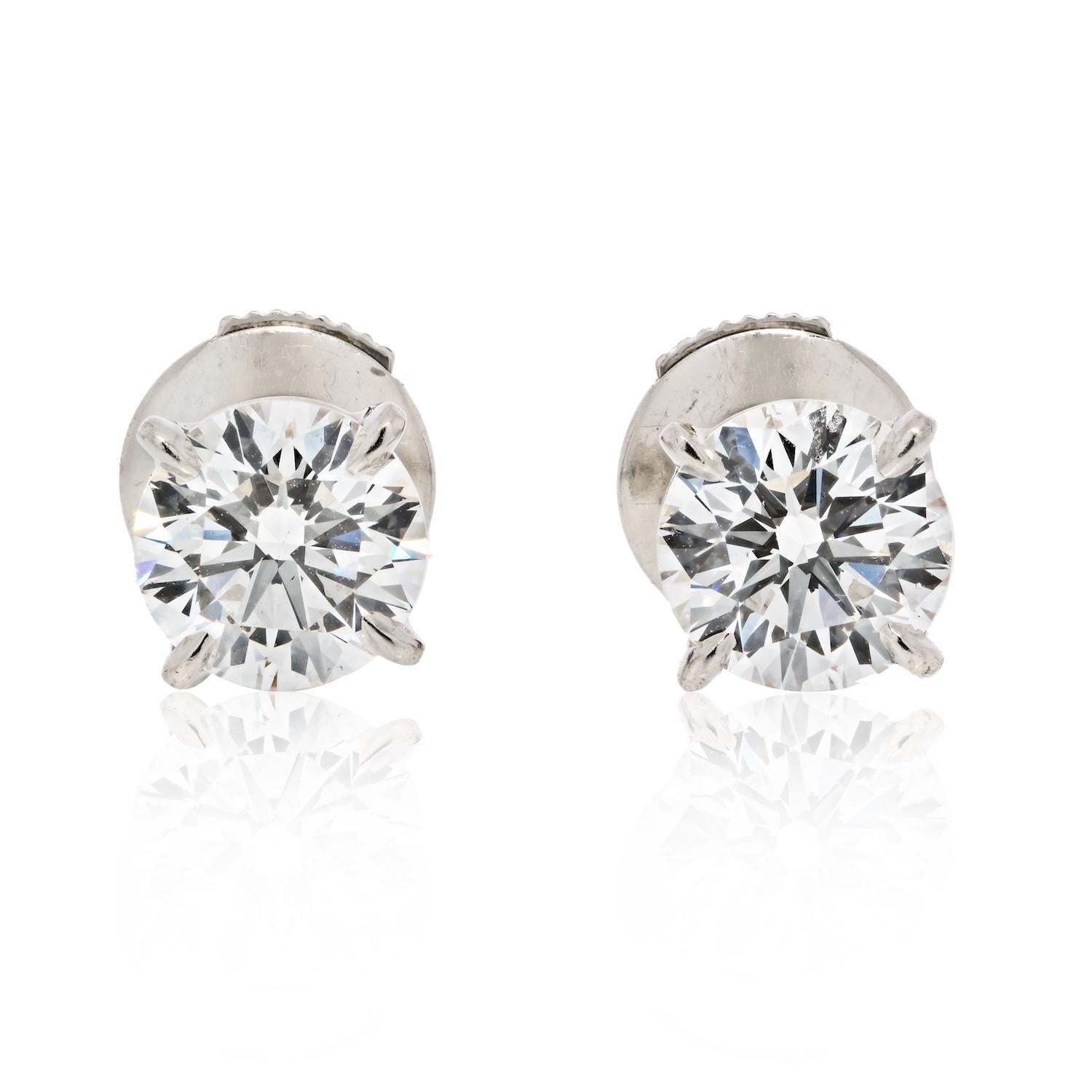 The Cartier 1.94cttw Round Cut Diamond Stud Earrings in platinum is a stunning pair of earrings that exude luxury and sophistication. 

Crafted by the renowned jewelry house of Cartier, these earrings are made with high-quality round cut diamonds