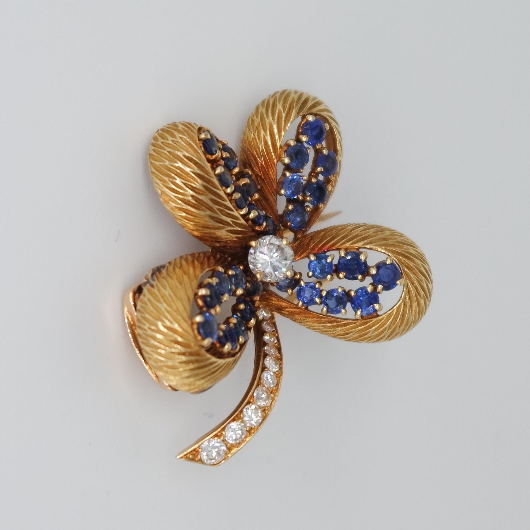 This four-leaf clover brooch by Cartier has become a classic design developed in many different versions by the Parisian Maison. 
It is also an exquisite lucky symbol to pin on your favorite jacket. 
This one, in 18 karat yellow gold, diamonds and