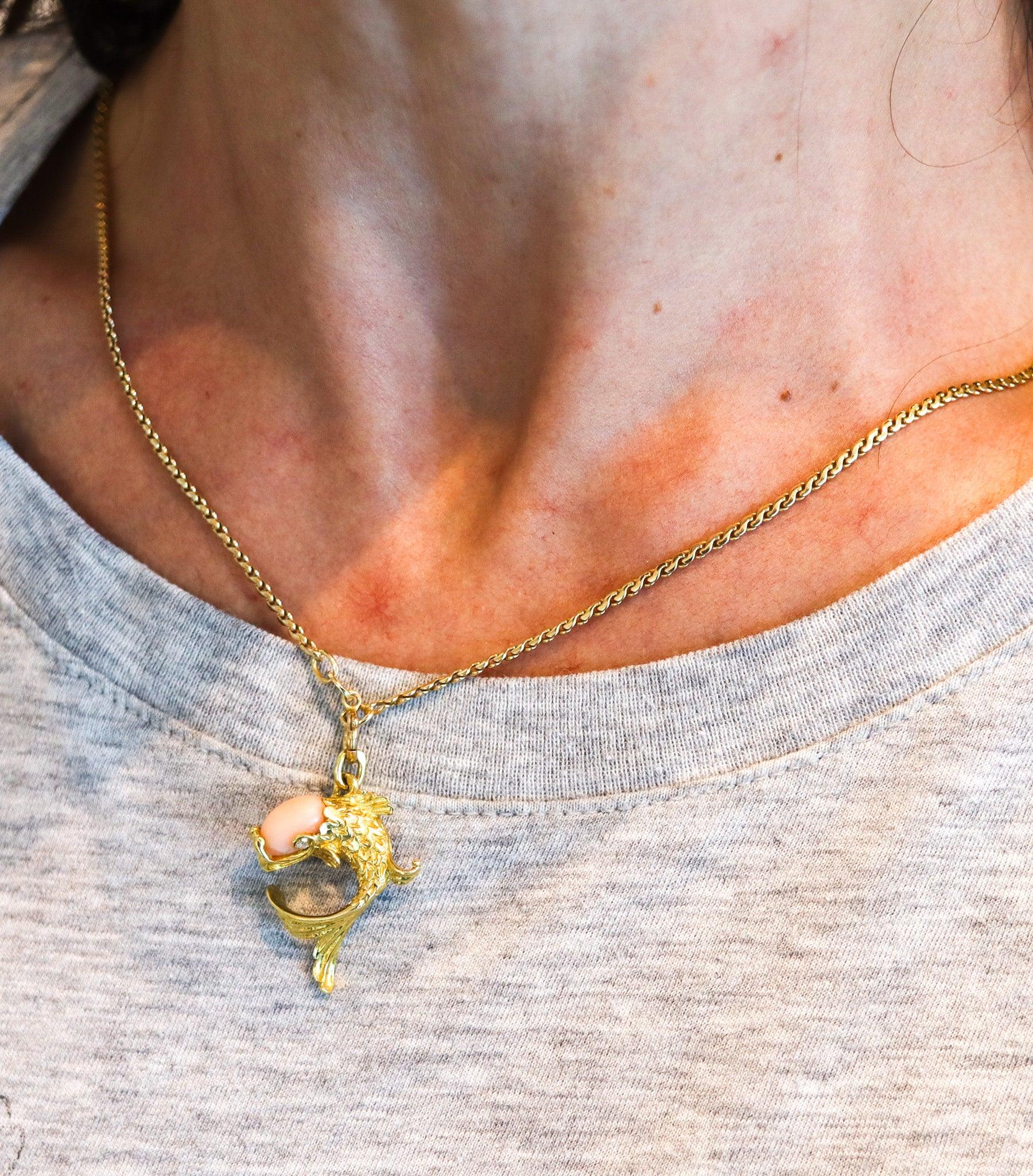 Piscis fish pendant-charm designed by Cartier.

This is a beautiful piscis fish pendant, created in Paris France by the jewelry house of Cartier, back in the 1950. The fish has been crafted in three dimensions in solid yellow gold of 18 karats with
