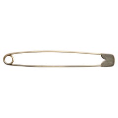 CARTIER 1960, New-York. A 18k yellow gold safety pin Brooch.