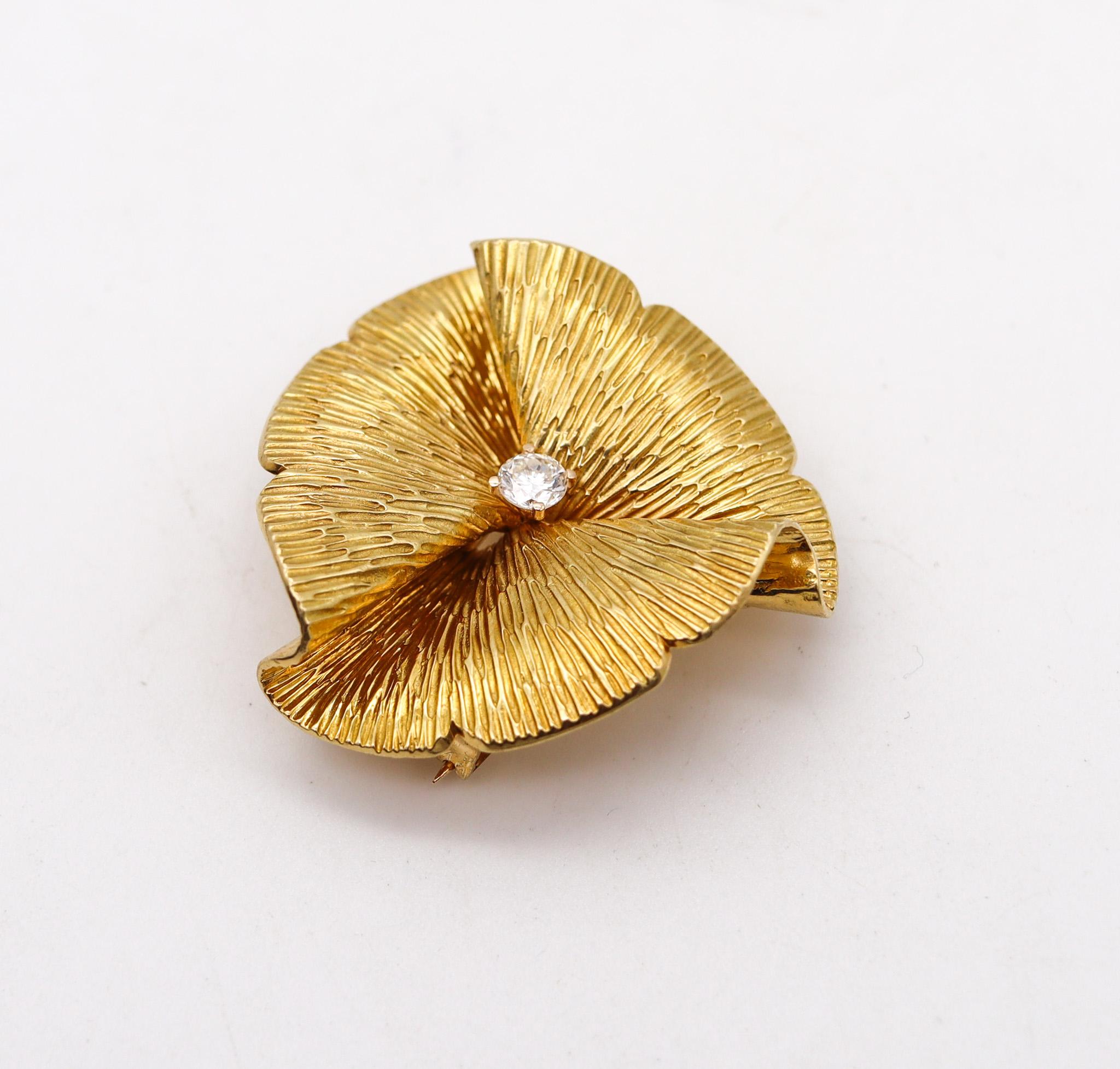 A textured brooch designed by Cartier.

Very beautiful brooch, created in New York city by George Schuler for the jewelry house of Cartier, back in the 1950-1960. This modernist folding wavy brooch has been crafted in solid rich yellow gold of 18
